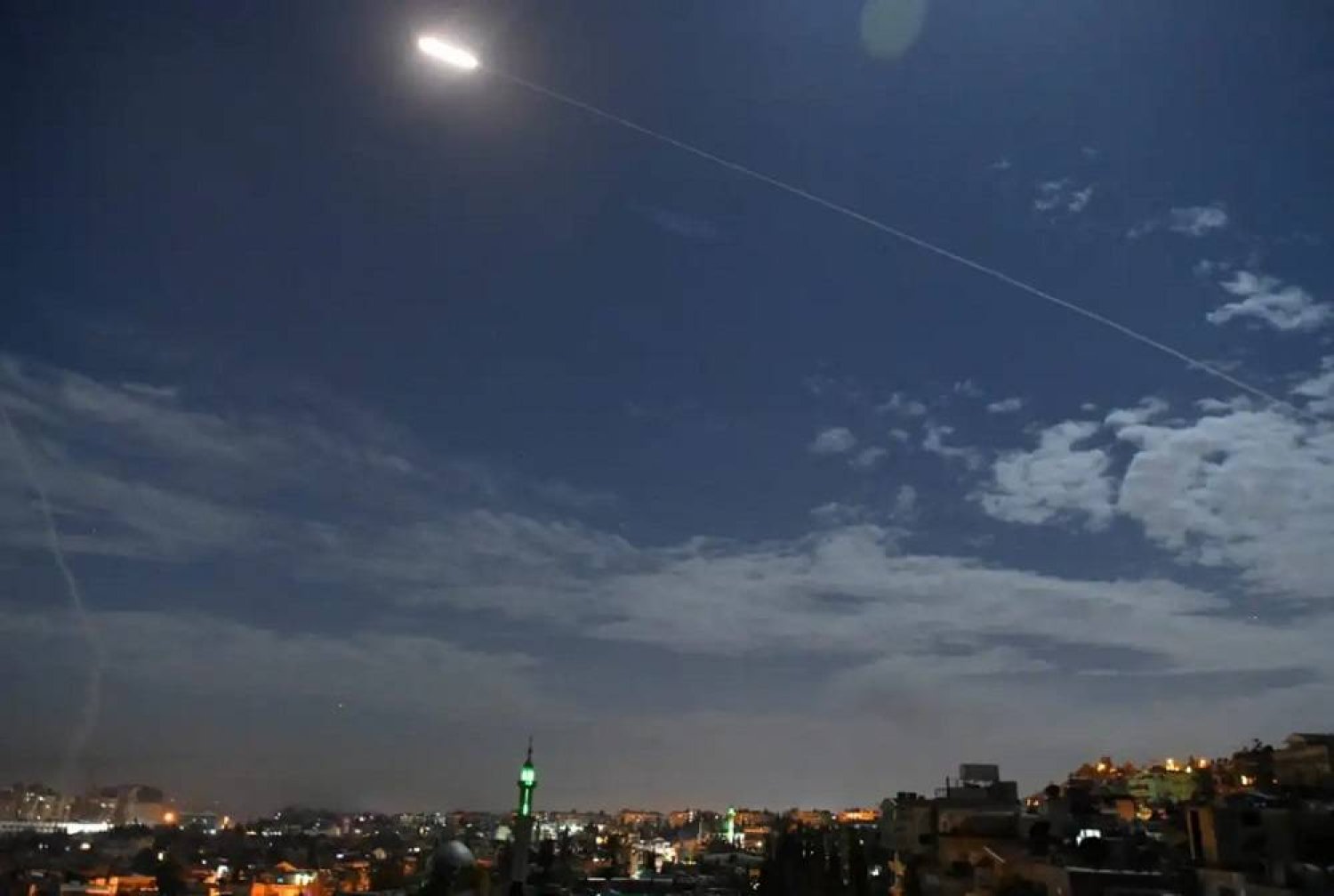 A picture taken early on 21 January, 2019 shows Syrian air defense batteries responding to what the Syrian state media said were Israeli missiles targeting Damascus. (AFP/Getty Images) 