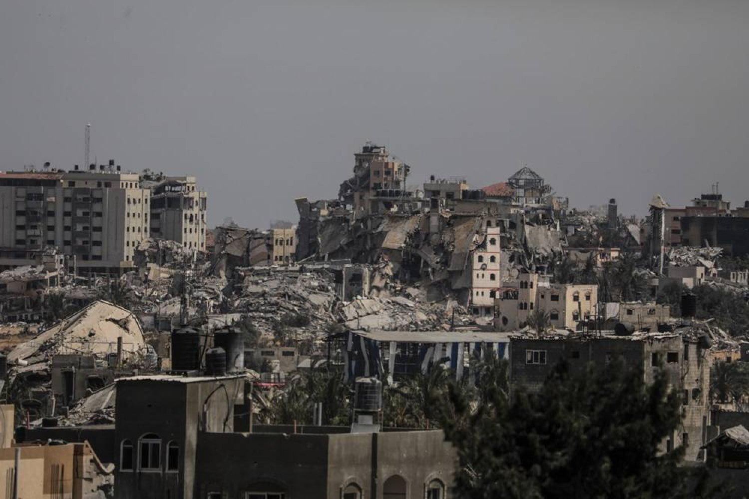 Destroyed buildings in the northern Gaza Strip, seen from the southern Gaza Strip, 23 April 2024. (EPA)