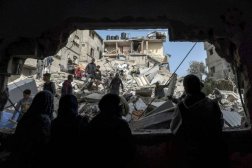Palestinians check the rubble of buildings that were destroyed following overnight Israeli bombardment in Rafah, in the southern Gaza Strip - AFP
