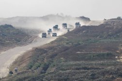  This picture taken from Israel's southern border with the Gaza Strip shows Israeli army vehicles driving along the border with the Palestinian territory on April 16, 2024, amid the ongoing conflict between Israel and Hamas. (AFP) 