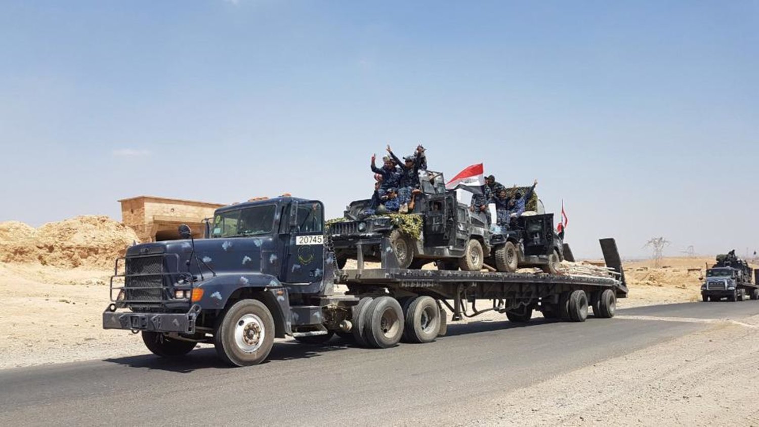 A handout picture released by the Iraqi Federal Police on August 15, 2017, shows Iraqi armored units headed for the town of Tal Afar. (AFP Photo) 