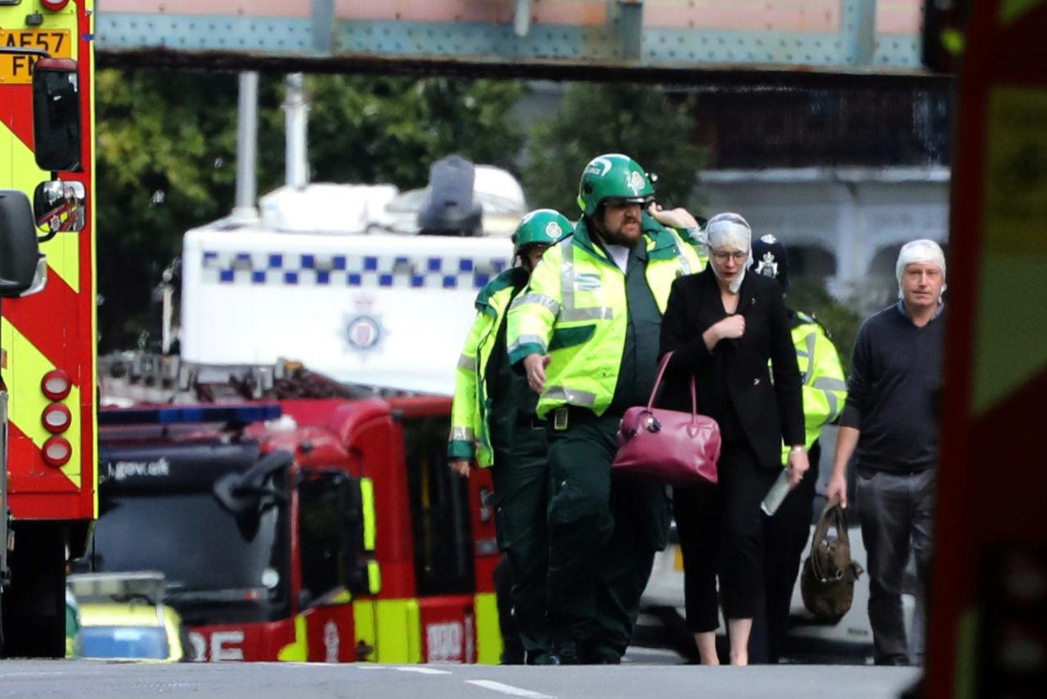 An injured woman is led away after the terrorist attack at Parsons Green underground station in London, Britain, September 15, 2017. REUTERS/Luke MacGregor 