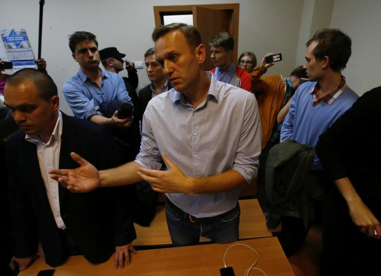 Russian opposition leader Alexei Navalny talks to journalists after he was sentenced to 20 days in jail on charges holding an unsanctioned protest. (Reuters)
