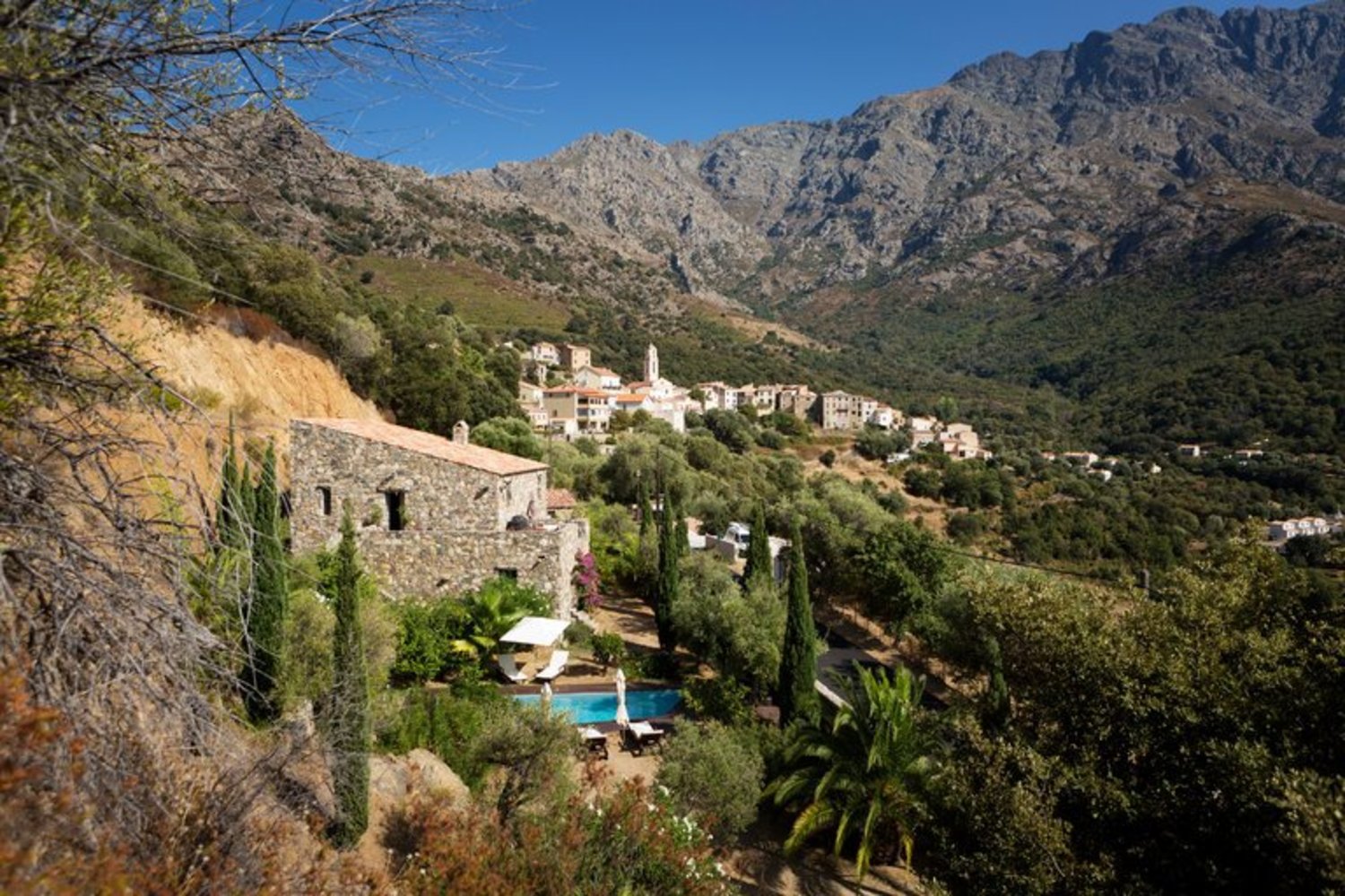 A two-story, three-bedroom stone villa that blends into the mountains in Zilia, Corsica, is on the market for $1.76 million. Credit Rebecca Marshall for The New York Times