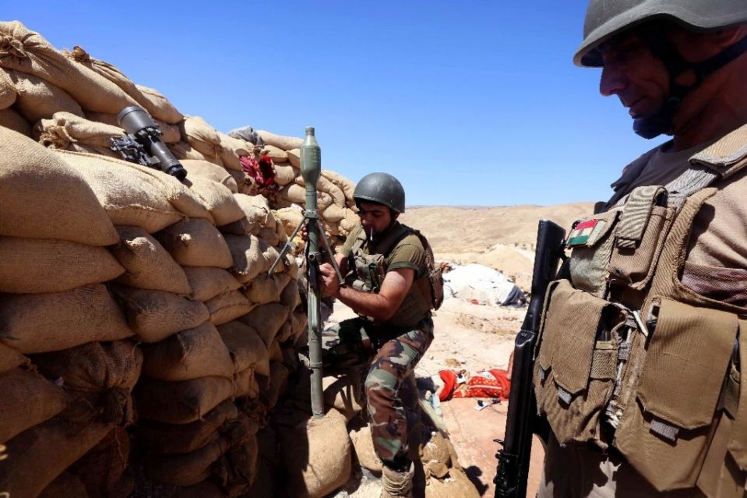 Iraqi Peshmerga fighters hold position near Sinjar. AFP file photo