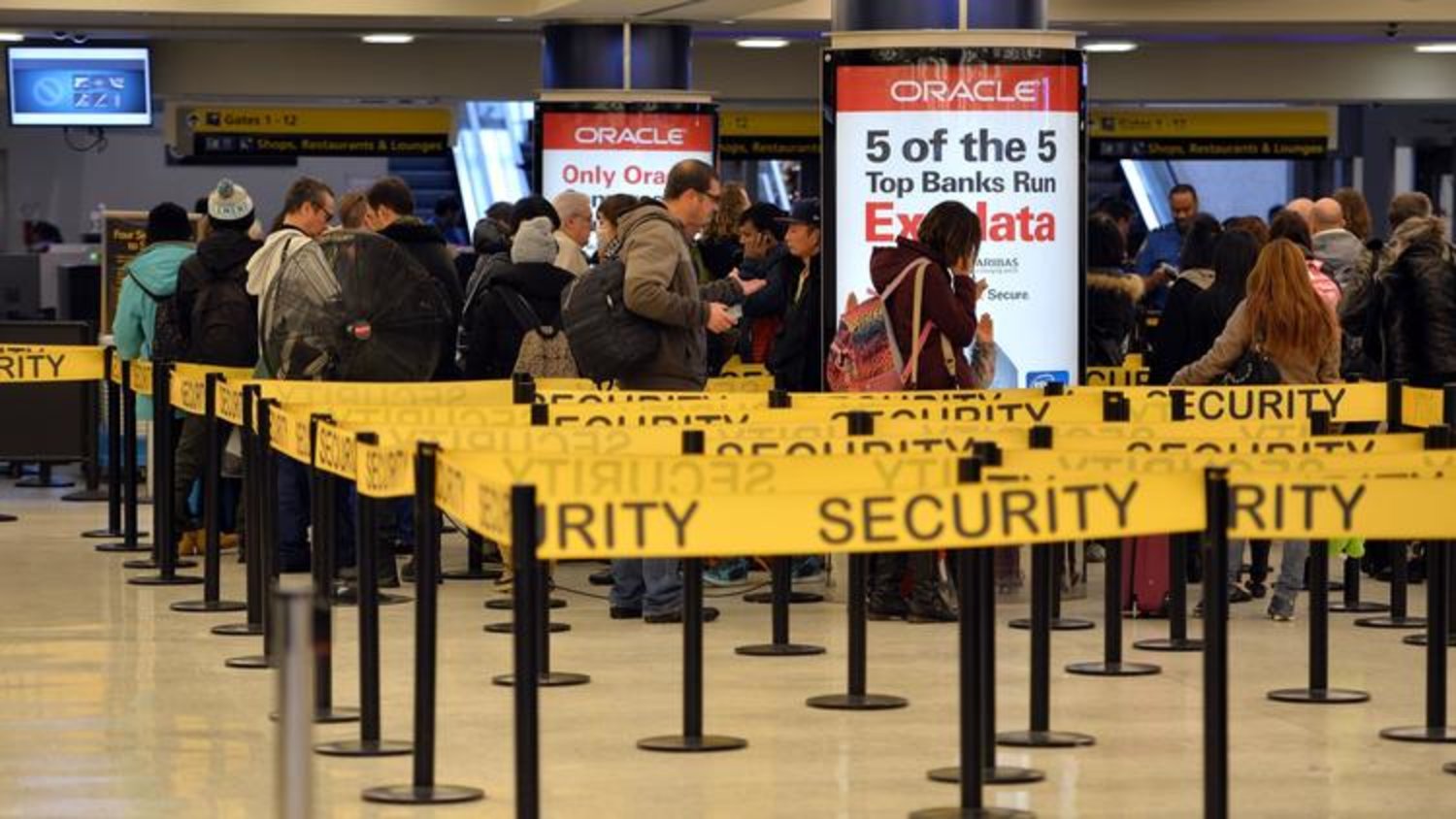 This Jan. 6, 2014, file photo shows people in security lines at Kennedy International Airport in New York. (Stan Honda, AFP/Getty Images)