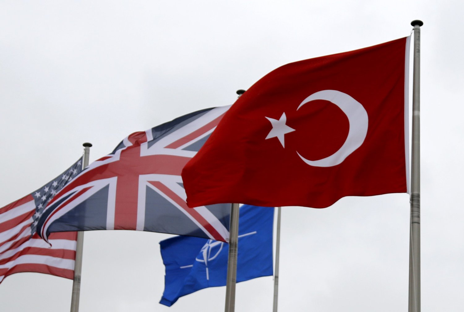 A Turkish flag flies among others flags of NATO members during the North Atlantic Council following Turkey's request for Article 4 consultations, at the Alliance headquarters in Brussels, Belgium, July 28, 2015. (FRANCOIS LENOIR/REUTERS)