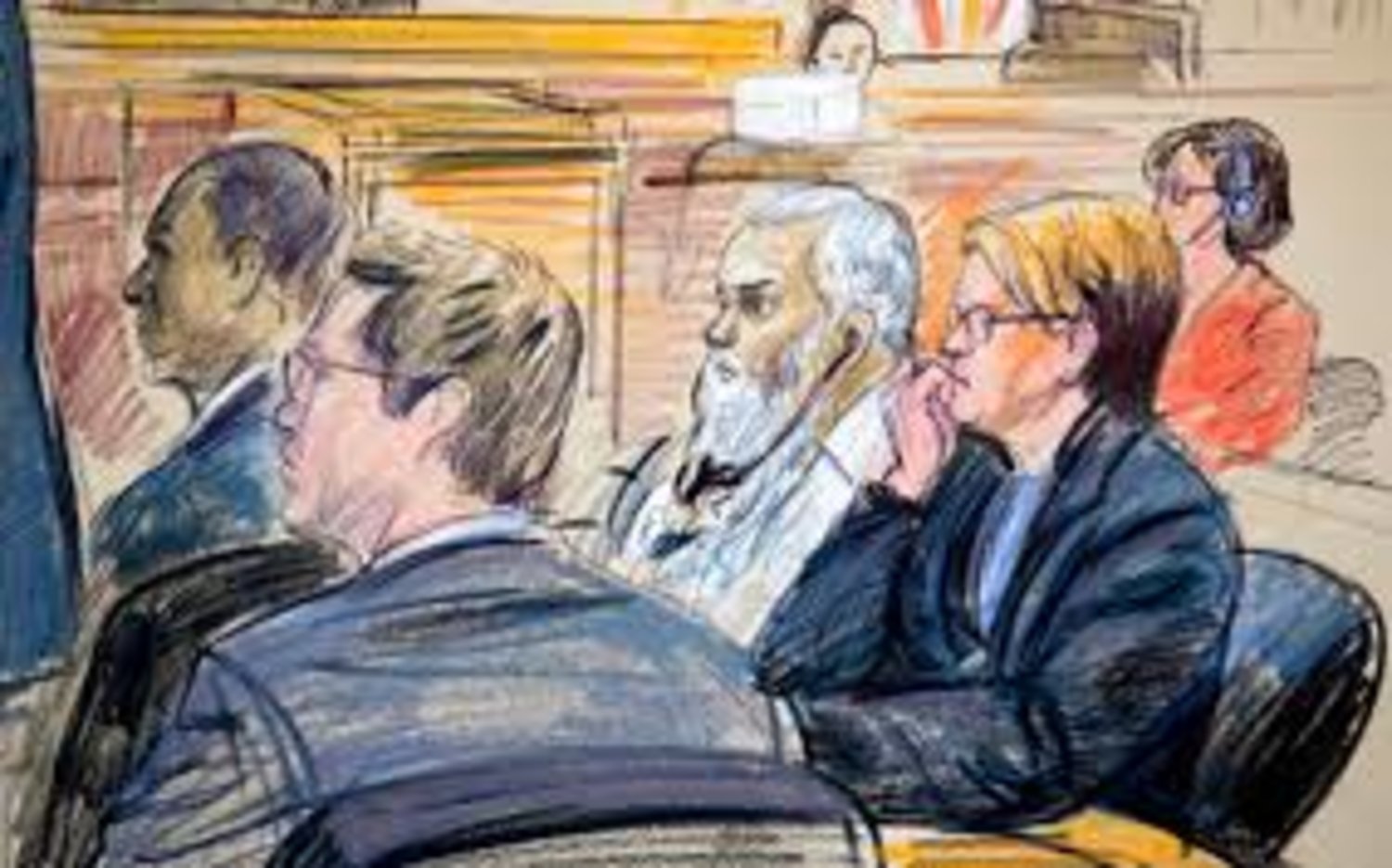 On trial for the 2012 Benghazi attacks on US facilities in Libya, Ahmed Abu Khattala is shown in a courtroom sketch listening to a translation of an opening statement Oct. 2. (Dana Verkouteren/AP) 