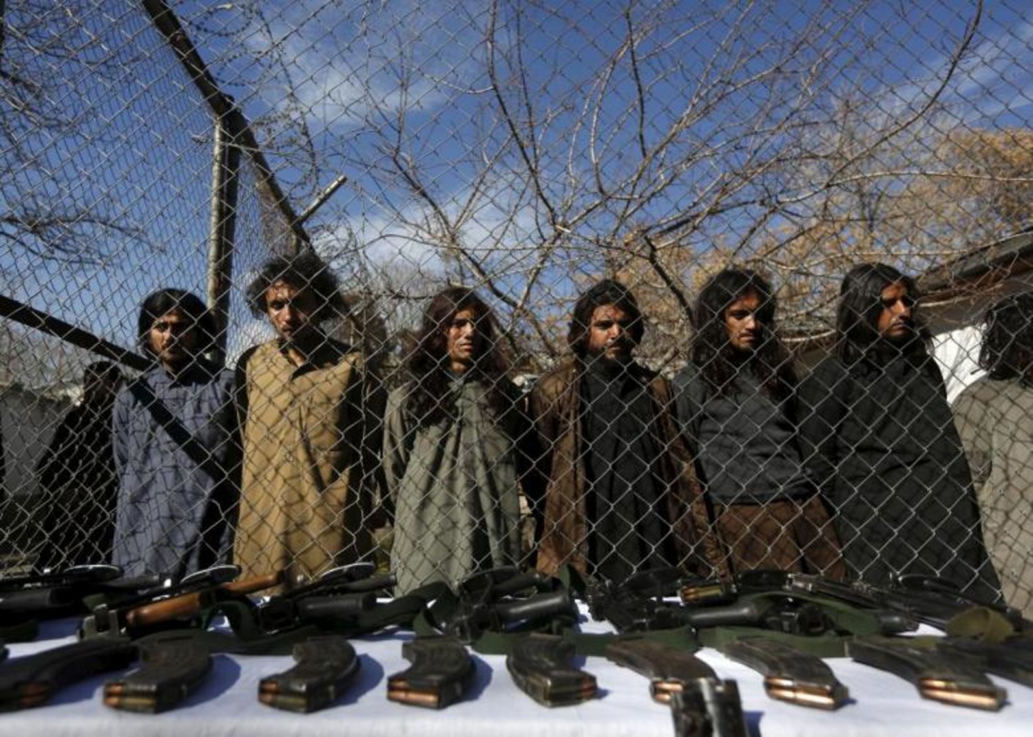 Pakistani Taliban fighters, who were arrested by Afghan border police, stand during a presentation of seized weapons and equipment to the media in Kabul, Afghanistan January 5, 2016. REUTERS/Omar Sobhani
