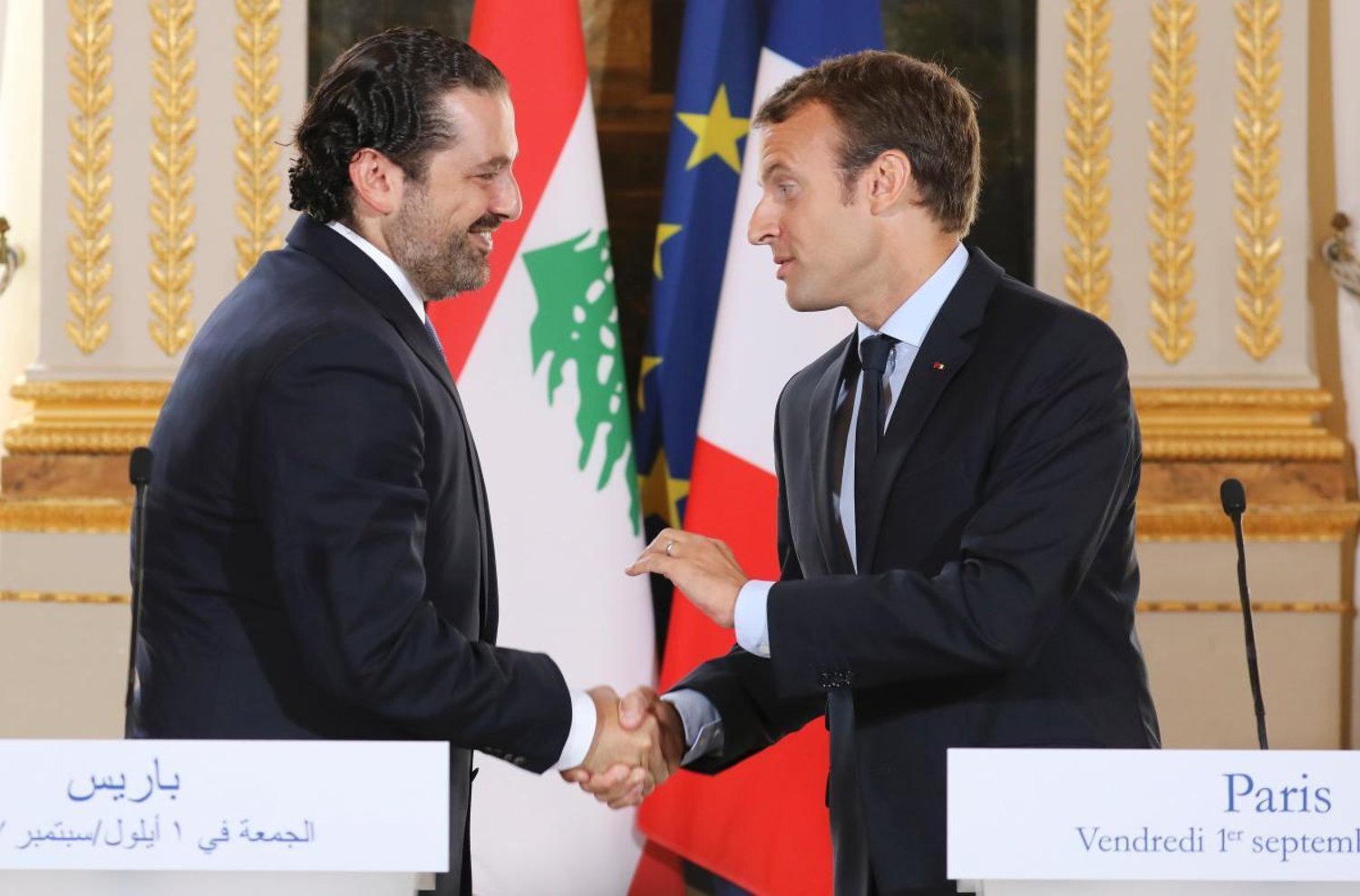 FILE - In this Sept. 1 2017 file photo, French President Emmanuel Macron, right, shakes hands with Lebanese Prime Minister Saad Hariri during a joint press conference at the Elysee Palace in Paris. (Ludovic Marin, Pool via AP, File)
