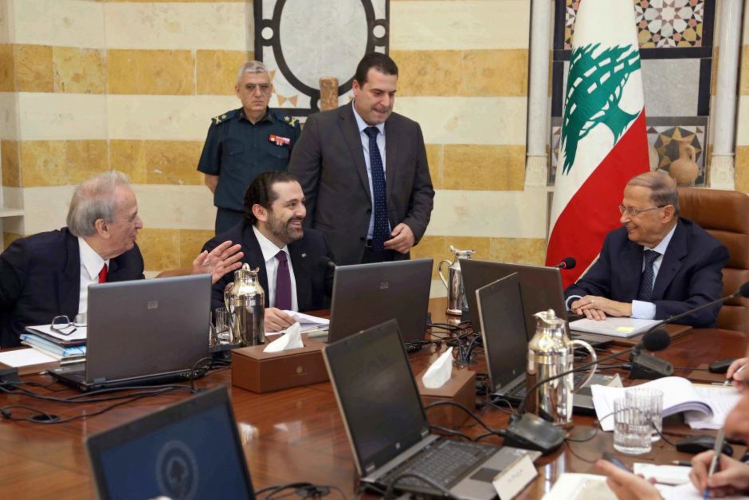 Lebanese President Michel Aoun (R) chats with Prime Minister Saad Hariri (C) as Education Minister Marwan Hamadeh (L) looks on during a cabinet meeting at the presidential palace in Baabda, Lebanon June 14, 2017. Dalati Nohra/Handout via REUTERS