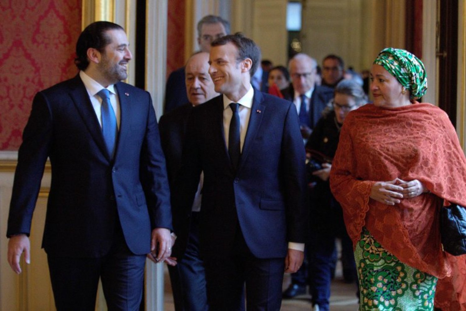 French President Emmanuel Macron (C) walks between Lebanon's Prime Minister Saad Hariri (L) and UN Deputy Secretary General Amina Mohammed (R) as they arrive to attend the Lebanon International Support Group meeting in Paris on Decdember 8, 2017.  PHILIPPE WOJAZER / POOL / AFP 