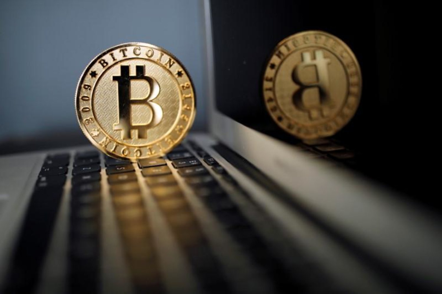 Bitcoin (virtual currency) coin is seen in an illustration picture taken at La Maison du Bitcoin in Paris, France, June 23, 2017. REUTERS/Benoit Tessier/Illustration