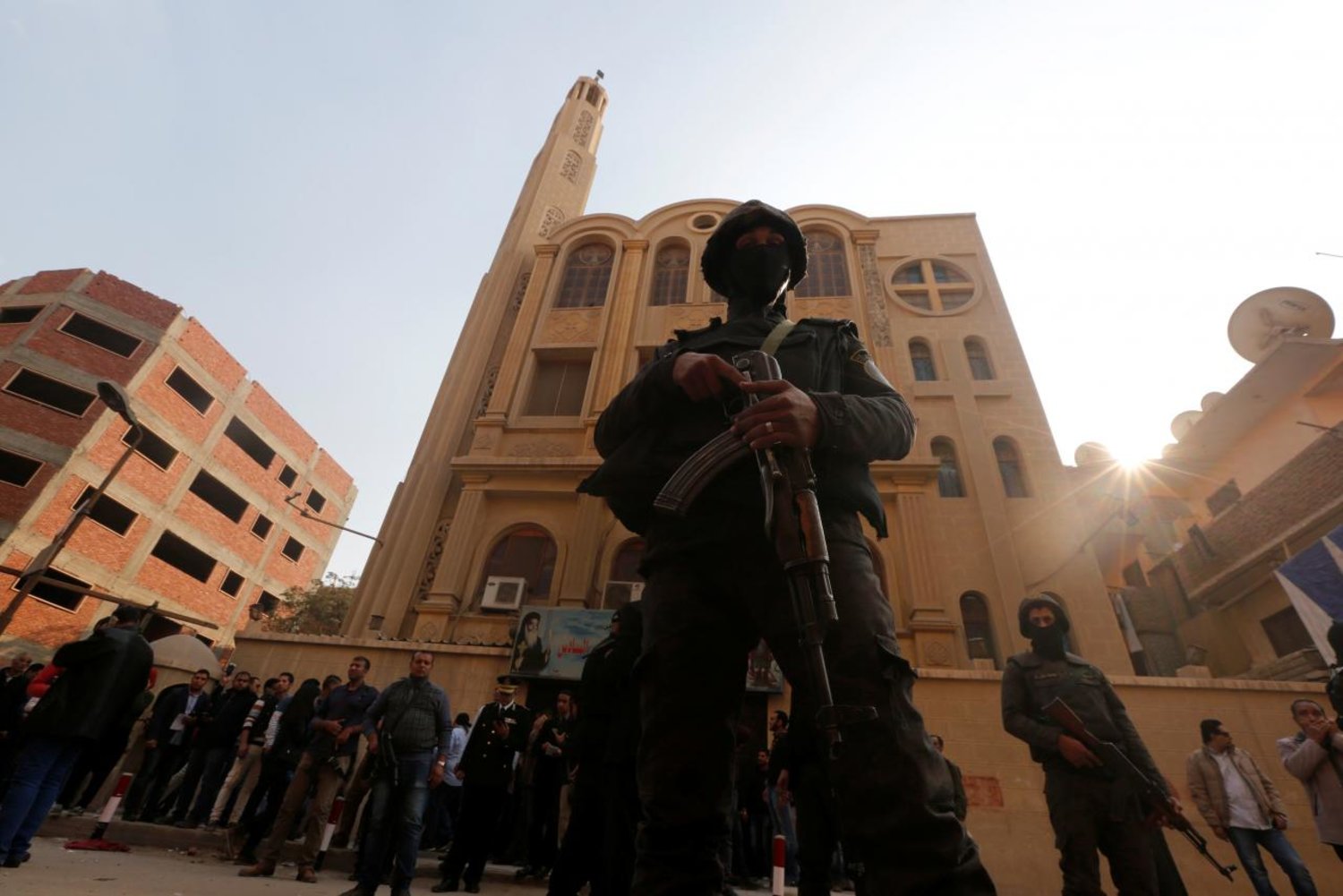 Security forces stand guard at the site of attack on a church in the Helwan district south of Cairo, Egypt December 29, 2017. (Reuters)