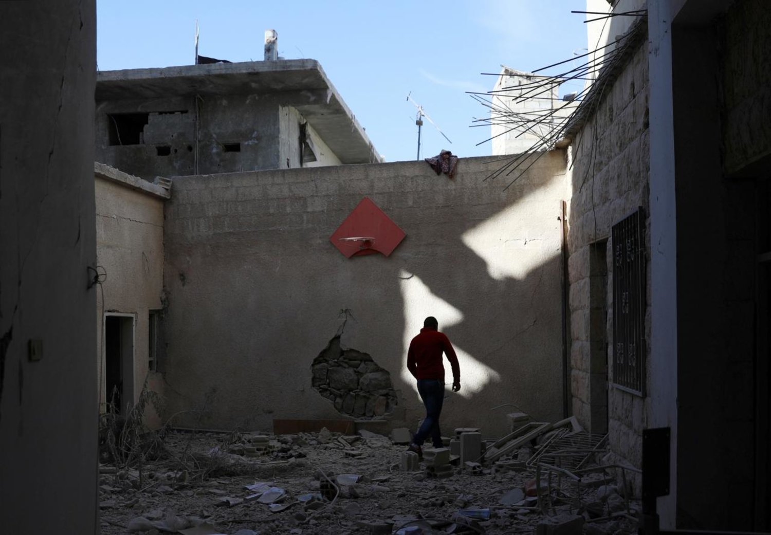 A man walks at a damaged site in the rebel-held area, in the city of Deraa, Syria December 12, 2017. Reuters