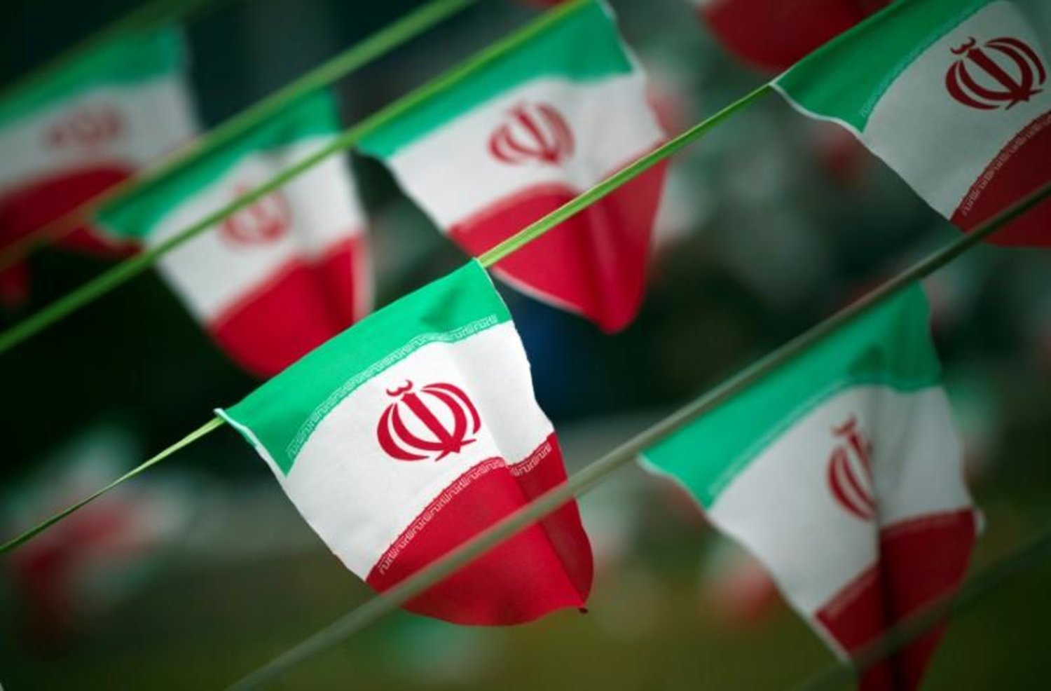 Iran's national flags are seen on a square in Tehran February 10, 2012. REUTERS/Morteza Nikoubazl/File Photo