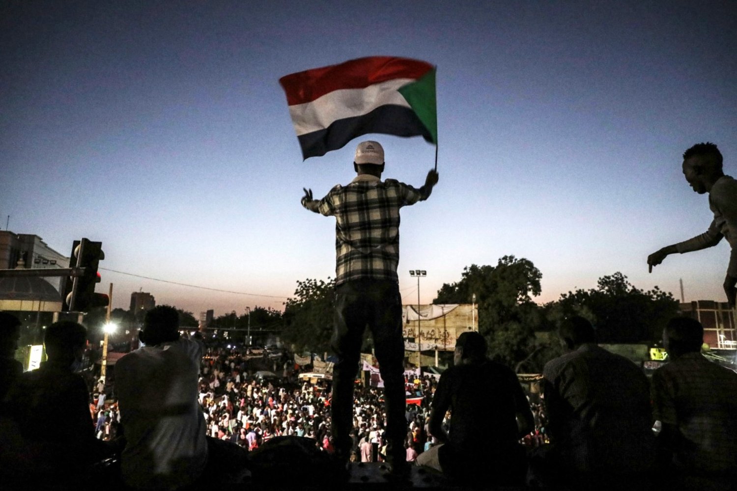 Sudanese protesters chant slogans during a rally outside the army headquarters in Sudan's capital Khartoum on Saturday, April 20, 2019. (AP)