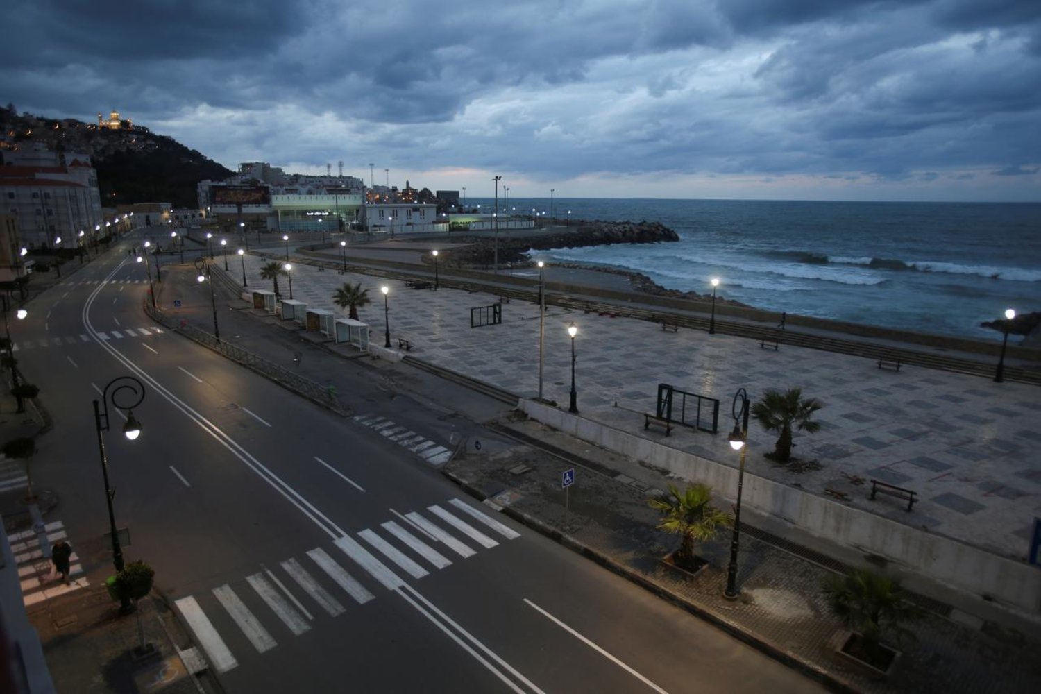 A general view shows an empty street after a curfew was imposed to prevent the spread of the coronavirus, in Algiers, Algeria March 25, 2020. (Reuters)