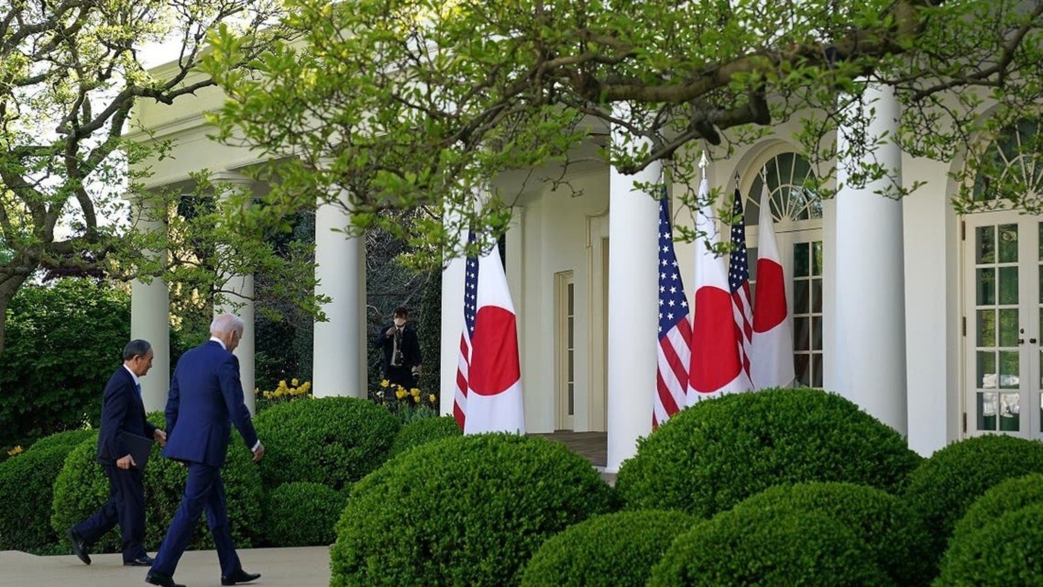 US President Joe Biden and Japan's former PM Yoshihide at the White House, April 16, 2021. (AFP)
