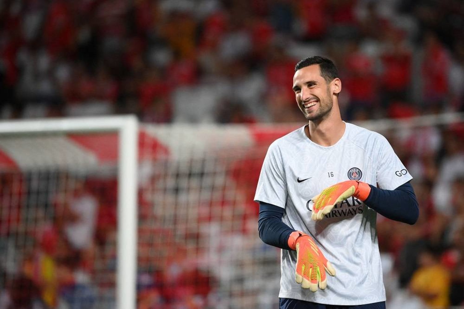 Paris St Germain Spanish goalkeeper Sergio Rico smiles as he warms up before the UEFA Champions League 1st round day 3 group H football match between SL Benfica and Paris Saint-Germain, at the Luz stadium in Lisbon on October 5, 2022. (AFP) 