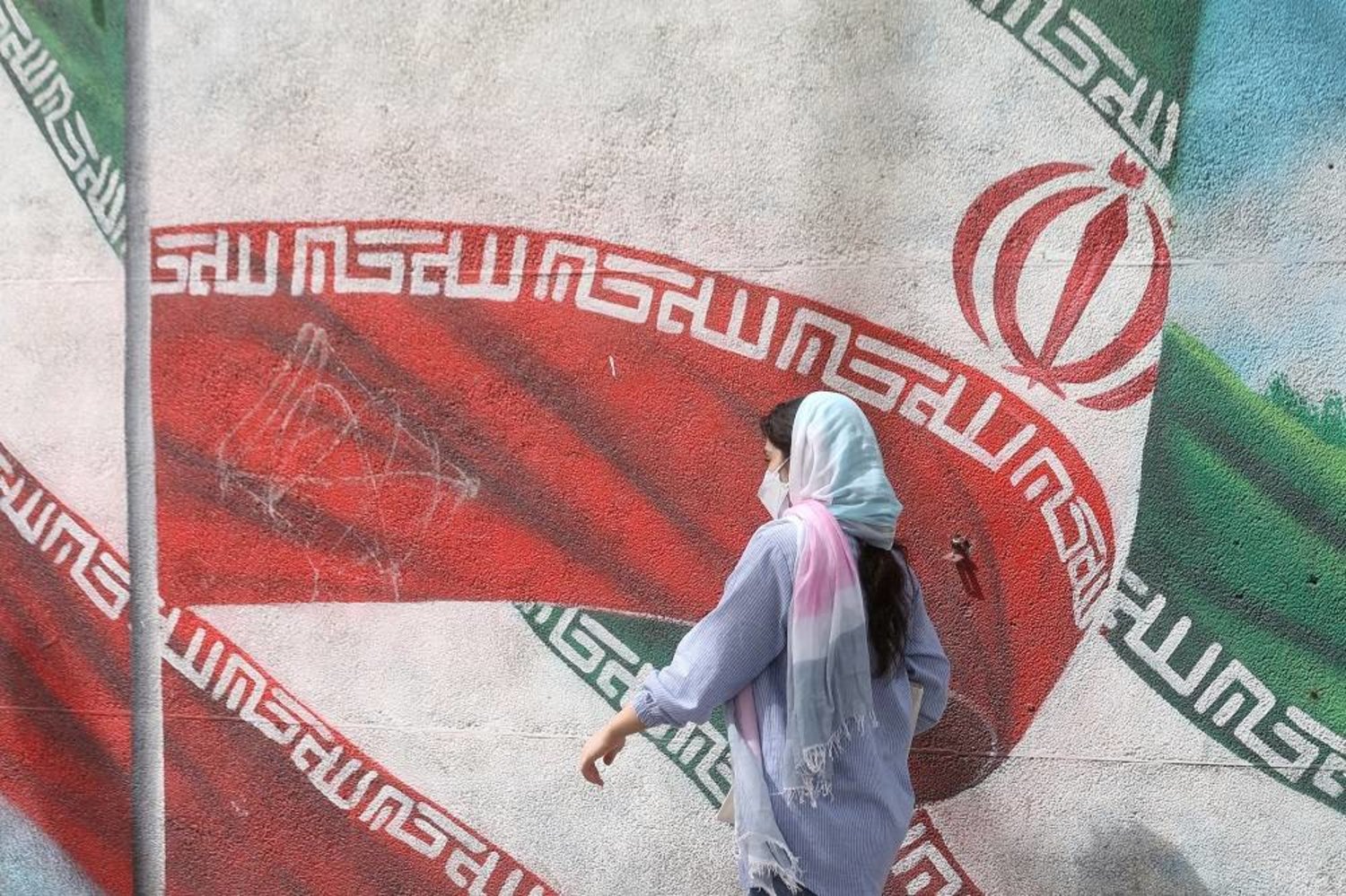 An Iranian woman walks in a street in Tehran, Iran, April 9, 2023. WANA (West Asia News Agency) via Reuters 