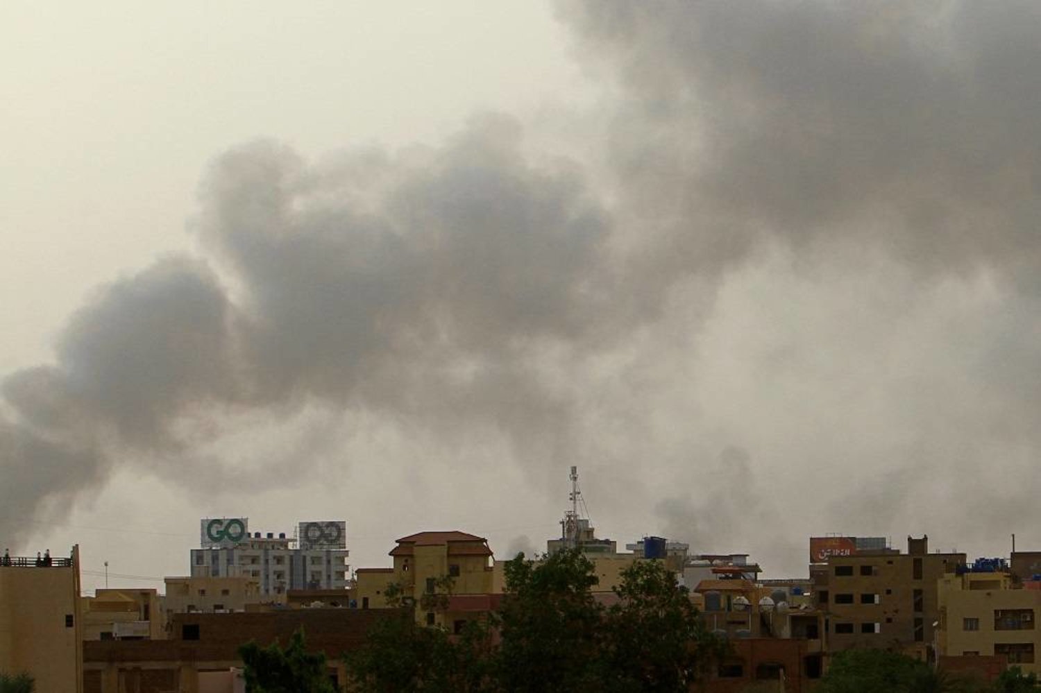 Smoke billows over buildings in southern Khartoum on May 29, 2023, amid ongoing fighting between the forces of two rival generals. (AFP) 