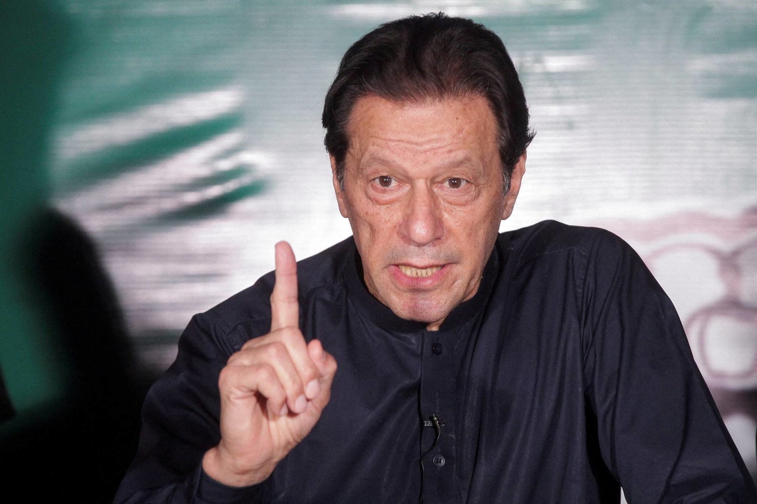 FILE PHOTO: Pakistan's former Prime Minister Imran Khan, gestures as he speaks to the members of the media at his residence in Lahore, Pakistan May 18, 2023. REUTERS/Mohsin Raza/File Photo