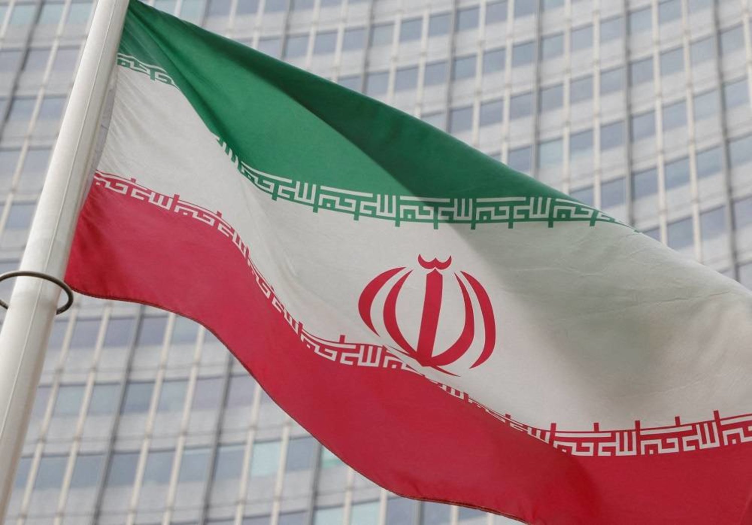 The Iranian flag flutters outside the International Atomic Energy Agency (IAEA) headquarters in Vienna, Austria, March 6, 2023. (Reuters) 
