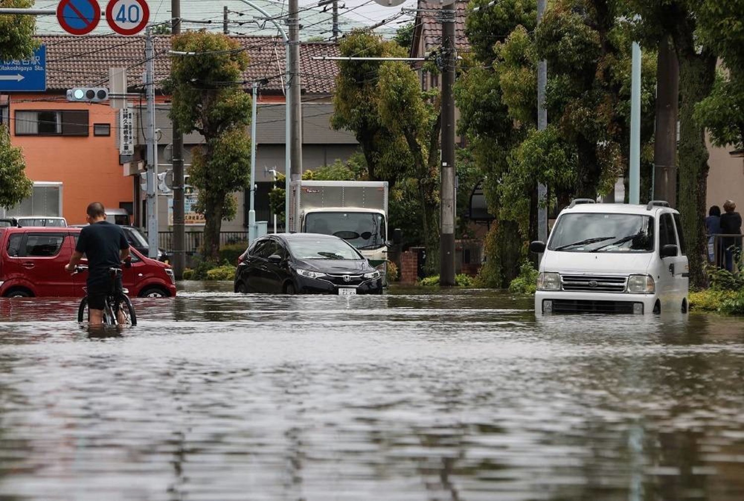 A general view shows a flooded street in Koshigaya, Saitama Prefecture on June 3, 2023, after heavy rains caused by passing Tropical Storm Mawar hit much of the country the day before. (AFP) 