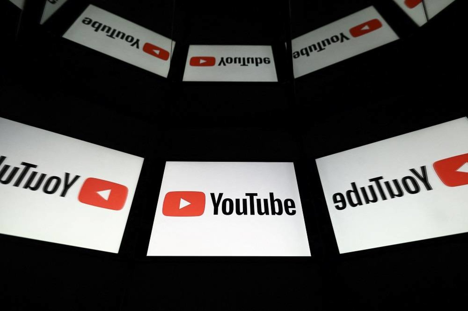 A picture taken on October 5, 2021 in Toulouse shows the logo of YouTube social media displayed by a tablet. (AFP)
