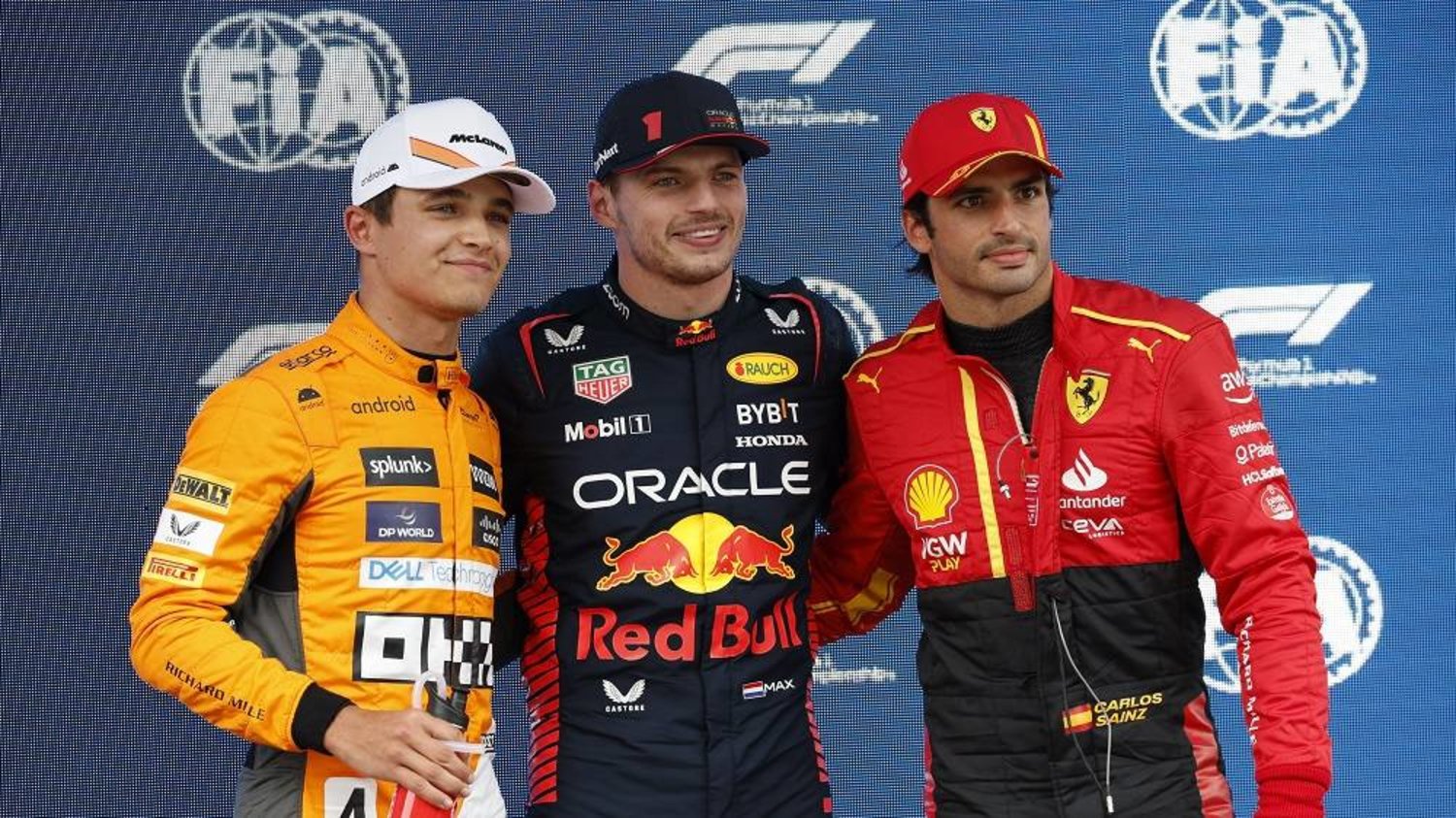 Red Bull driver Max Verstappen of the Netherlands, center who clocked the fastest time, poses with Ferrari driver Carlos Sainz of Spain, right, 2nd fastest and McLaren driver Lando Norris of Britain, 3rd fastest after the Formula One qualifying session at the Barcelona Catalunya racetrack in Montmelo, just outside of Barcelona, Spain, Saturday, June 3, 2023. (AP) 