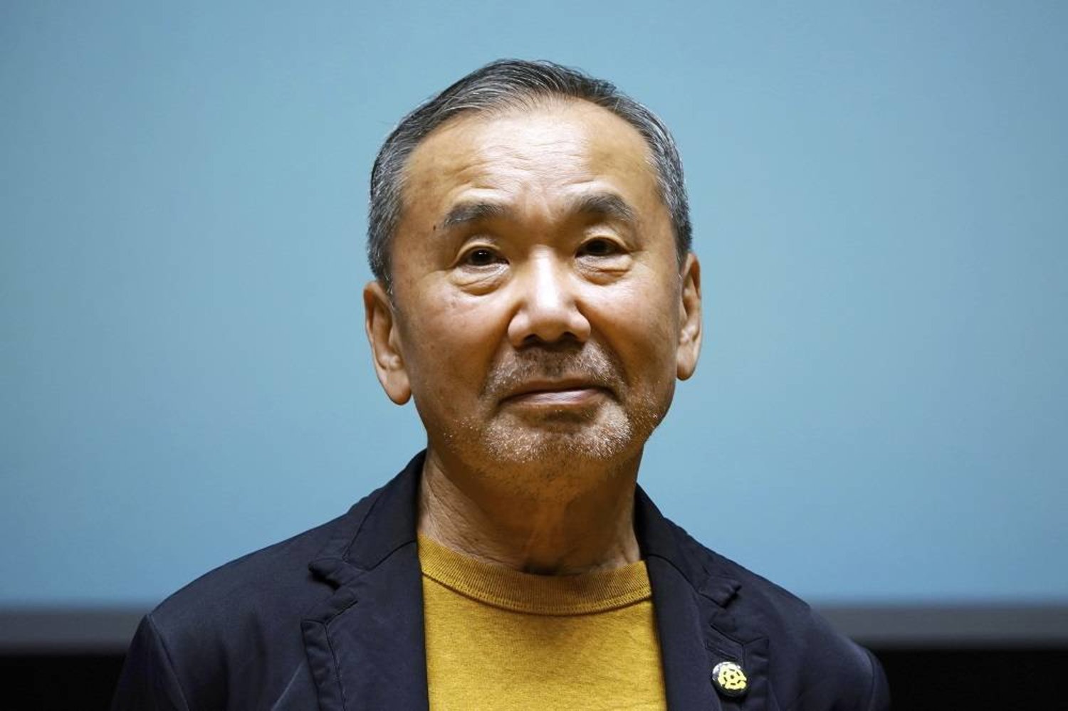 Japanese novelist Haruki Murakami poses for media during a press conference on the university's new international house of literature, The Haruki Murakami Library, opening at the Waseda University in Tokyo, on Sept. 22, 2021. (AP)
