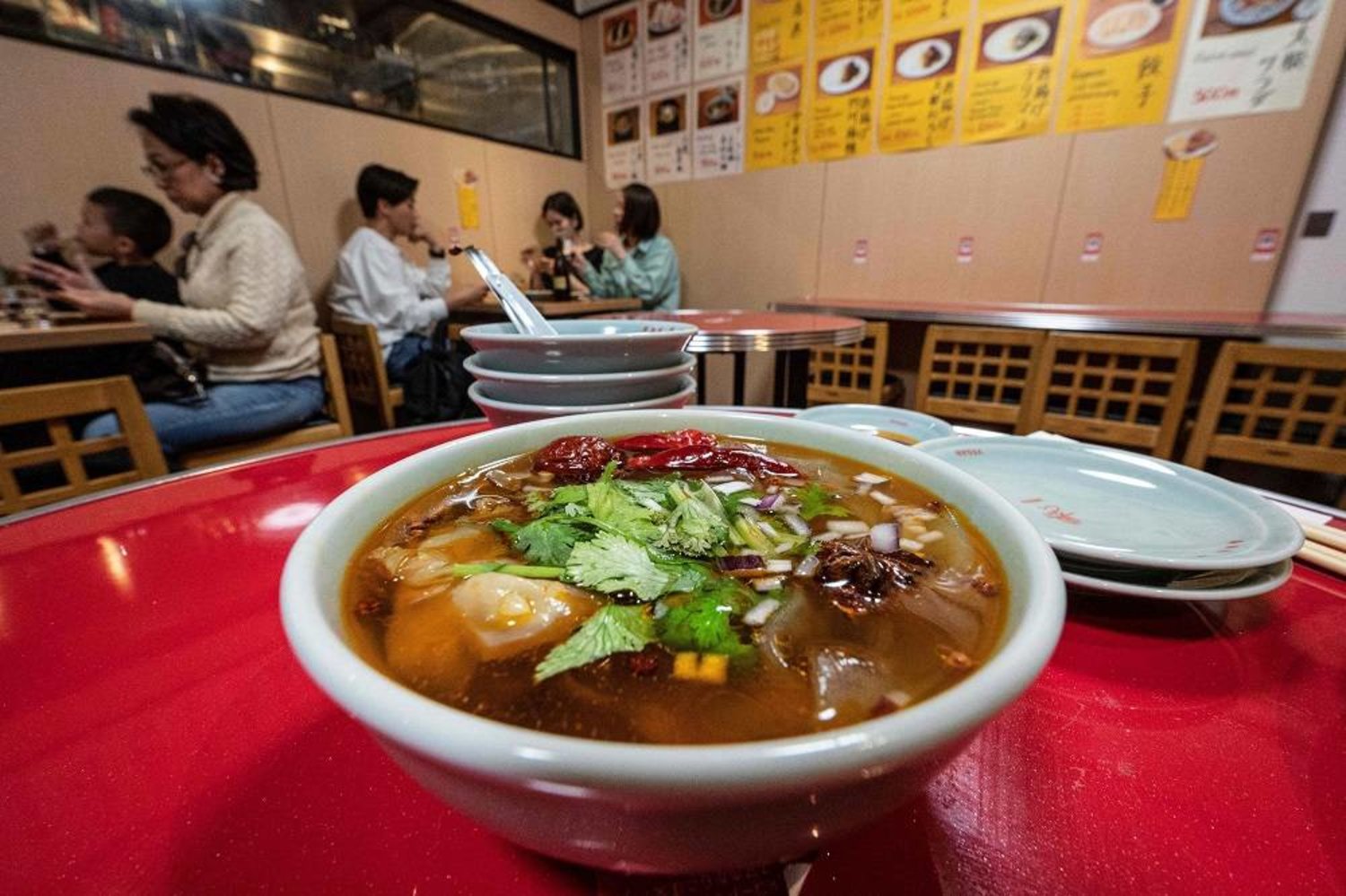 This photo taken on March 20, 2023 shows a dish of spicy glass noodles on a table at the Vegan Izakaya Masaka restaurant in the Shibuya area of Tokyo. (AFP) 