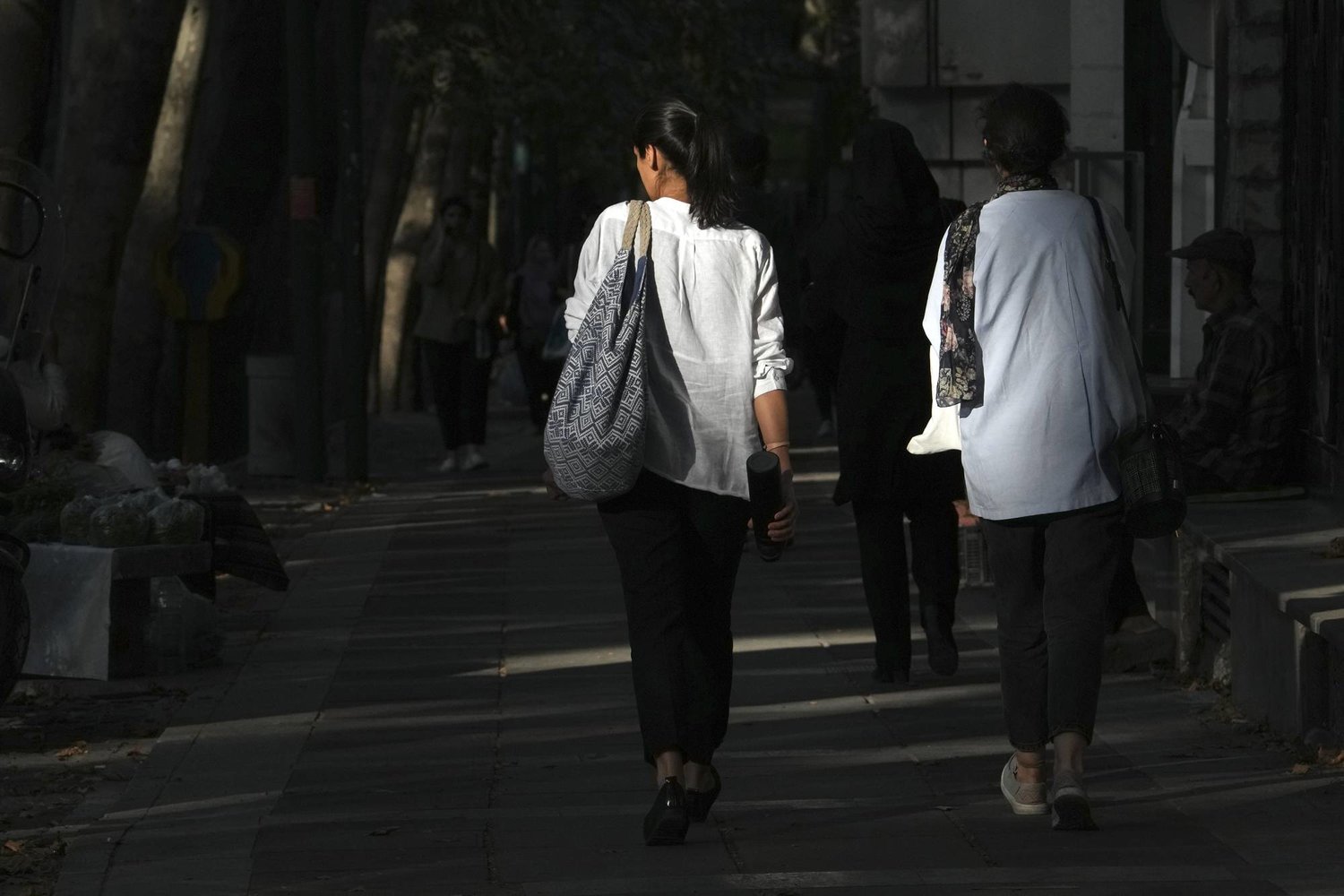 FILE - Iranian women walk in Tehran, Iran, Saturday, Aug. 5, 2023.  (AP Photo/Vahid Salemi, File)