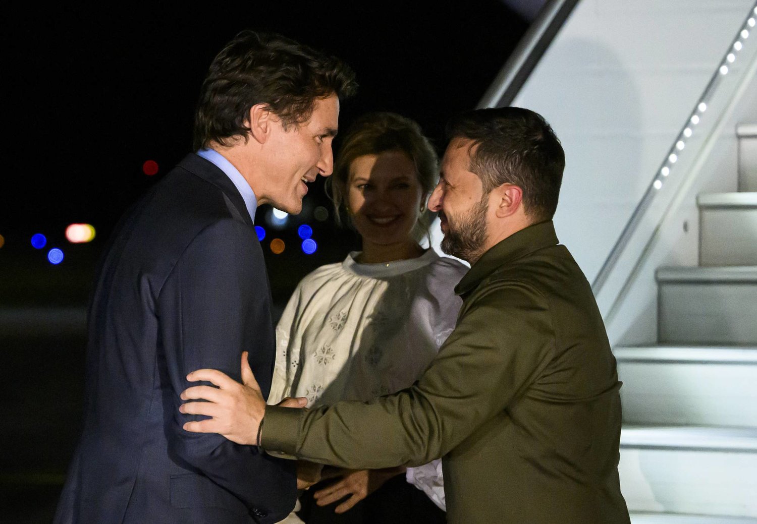 Canadian Prime Minister Justin Trudeau, left, greets Ukrainian President Volodymyr Zelenskyy, right, as his wife Olena Zelenska looks on as they arrive at Ottawa Macdonald-Cartier International Airport in Ottawa, Ontario, on Thursday, Sept. 21, 2023. (Justin Tang/The Canadian Press via AP)