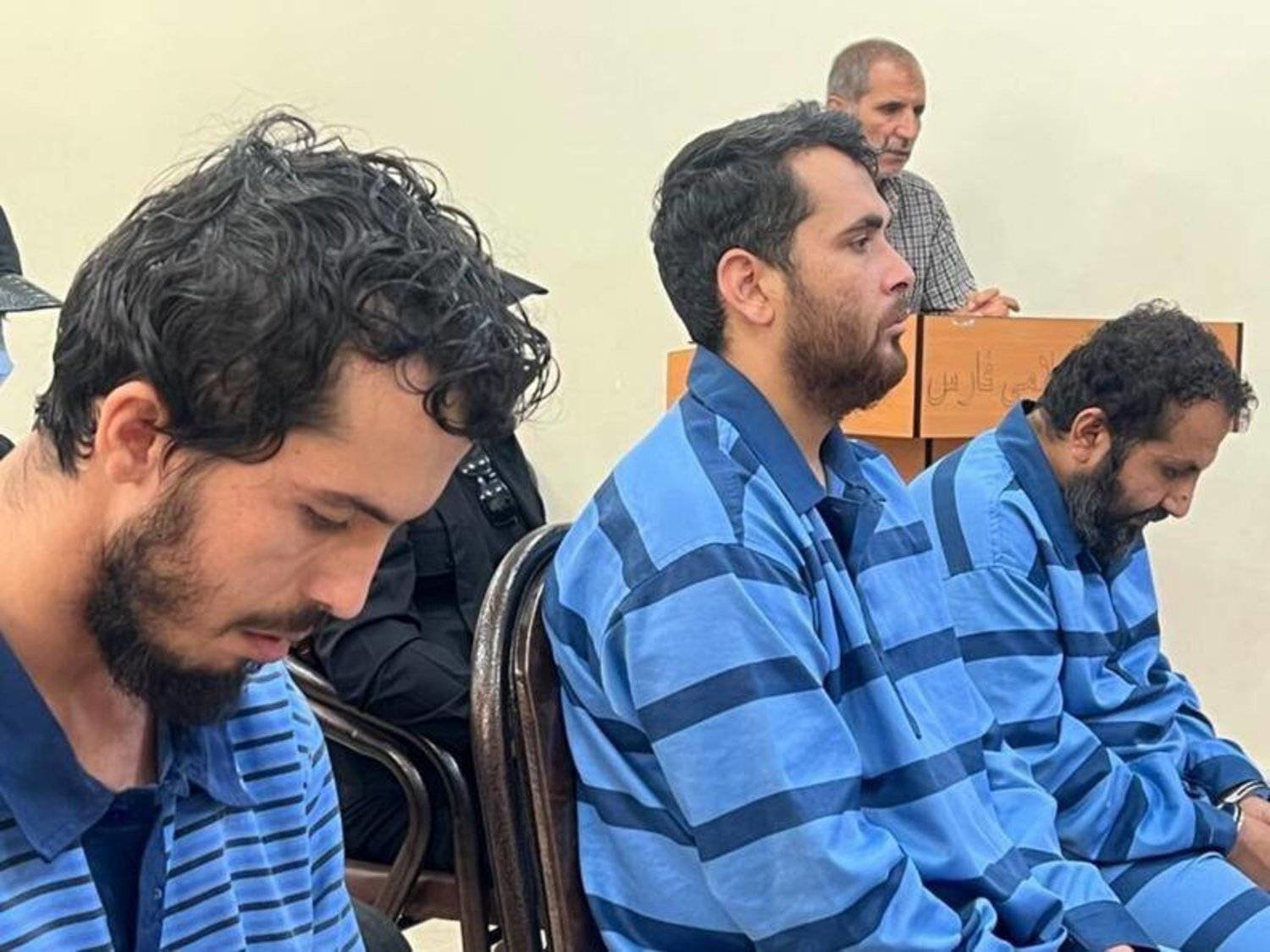 A photo released by Mizan from the trial of three suspects in the Shiraz attack.  