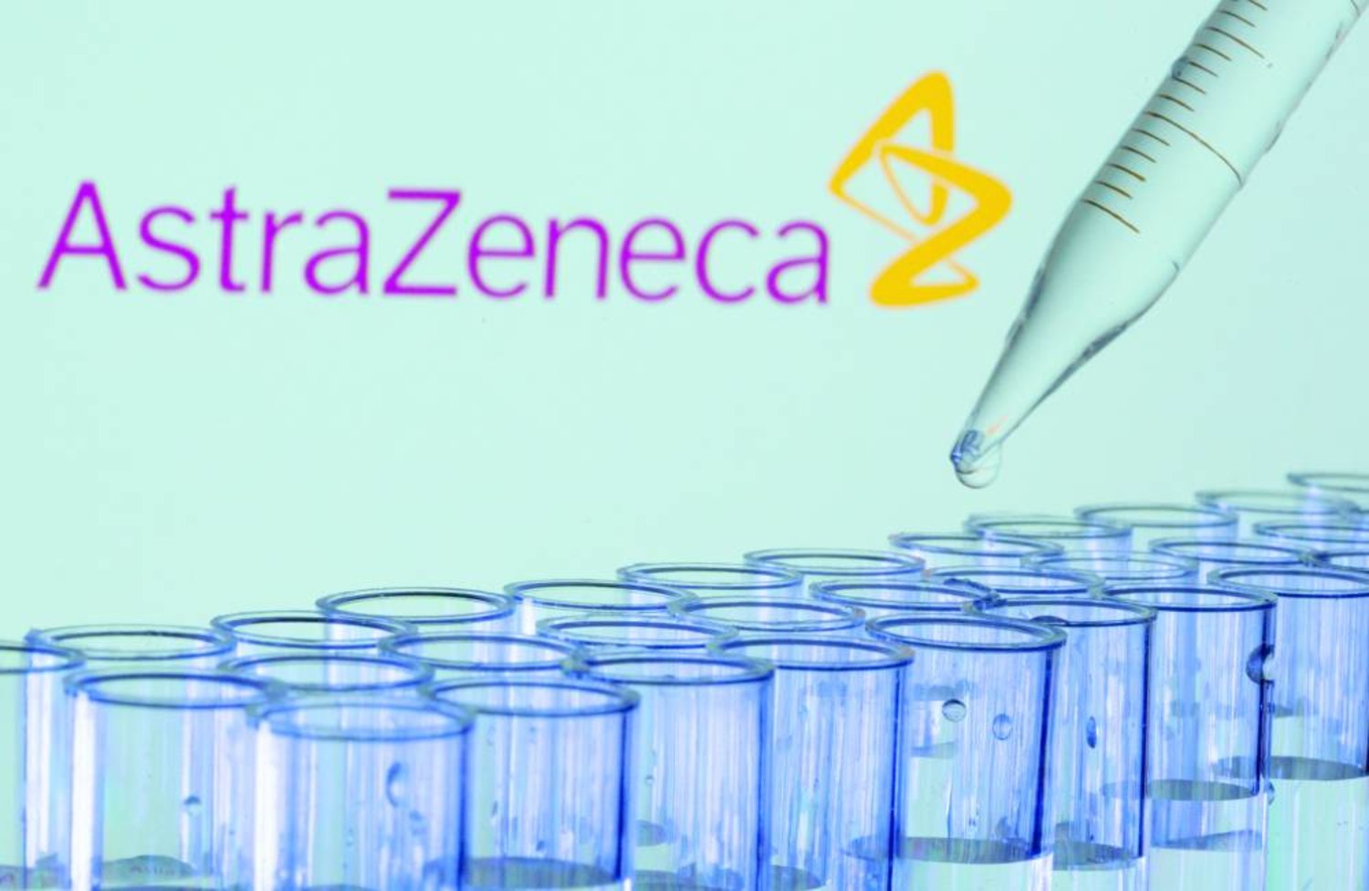 FILE PHOTO: Test tubes are seen in front of a displayed AstraZeneca logo in this illustration taken, May 21, 2021. REUTERS/Dado Ruvic/Illustration/File Photo/File Photo