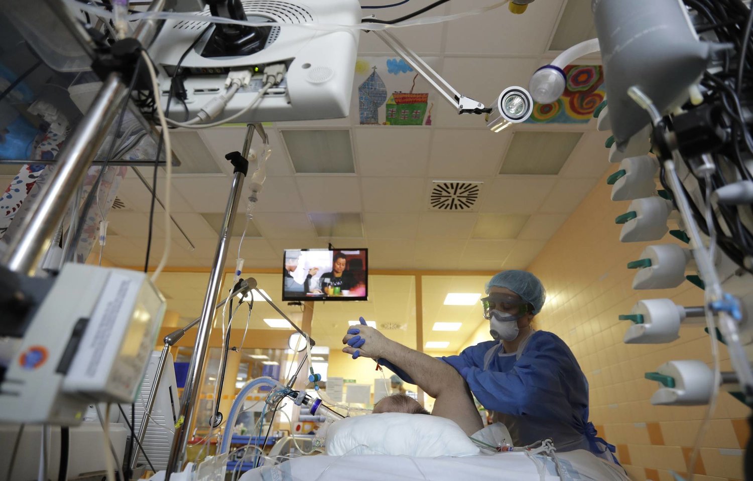  A health care worker attends to a COVID-19 patient in an
intensive care unit at the General University Hospital in Prague on
Tuesday. | AP