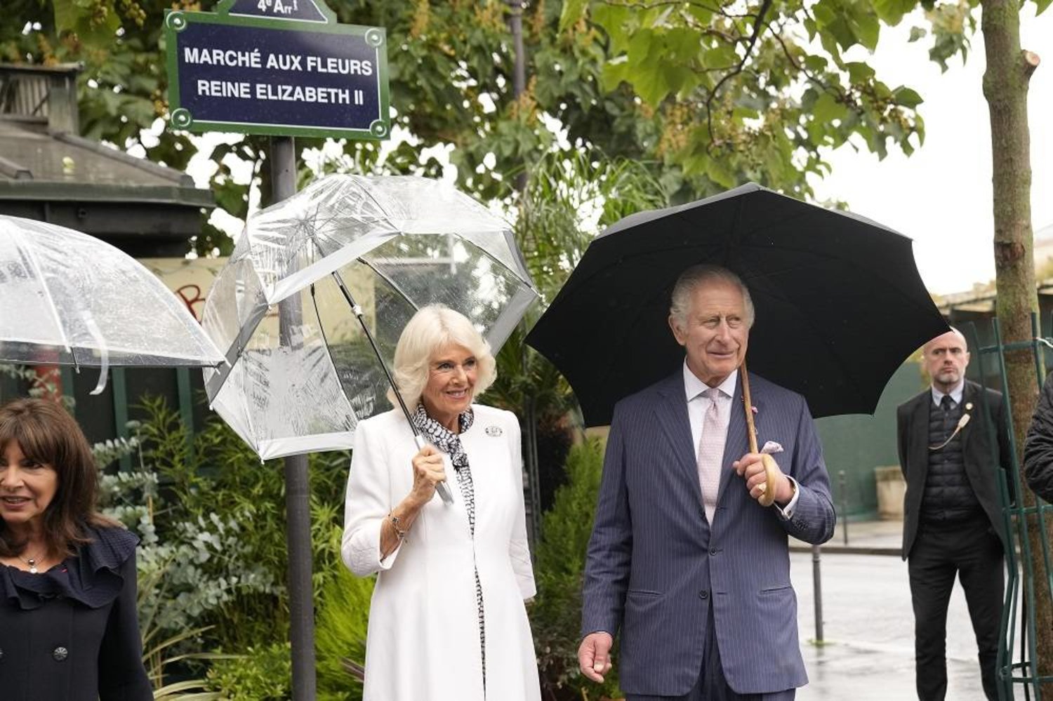 Britain's King Charles III and Queen Camilla pose at a plaque named after his late mother, Queen Elizabeth II at the Flower Market Thursday, Sept. 21, 2023 in Paris. (AP)