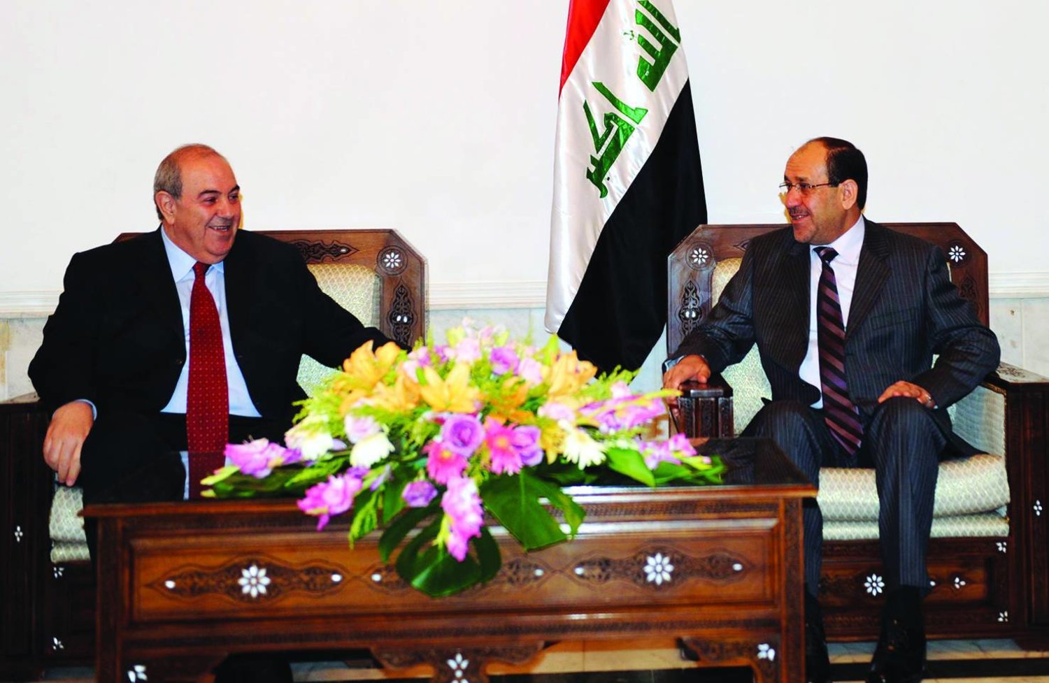 Allawi and Al-Maliki in one of their meetings in Baghdad in 2010 (Getty)
 
