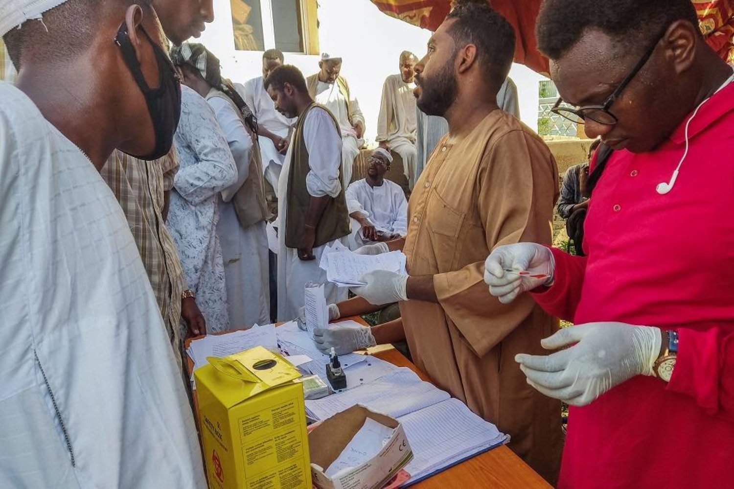 People queue at a medical laboratory to get tested for dengue fever in the eastern Qadarif state of war-torn Sudan on September 22, 2023, amid reports of the spread of the viral infection. (AFP) 