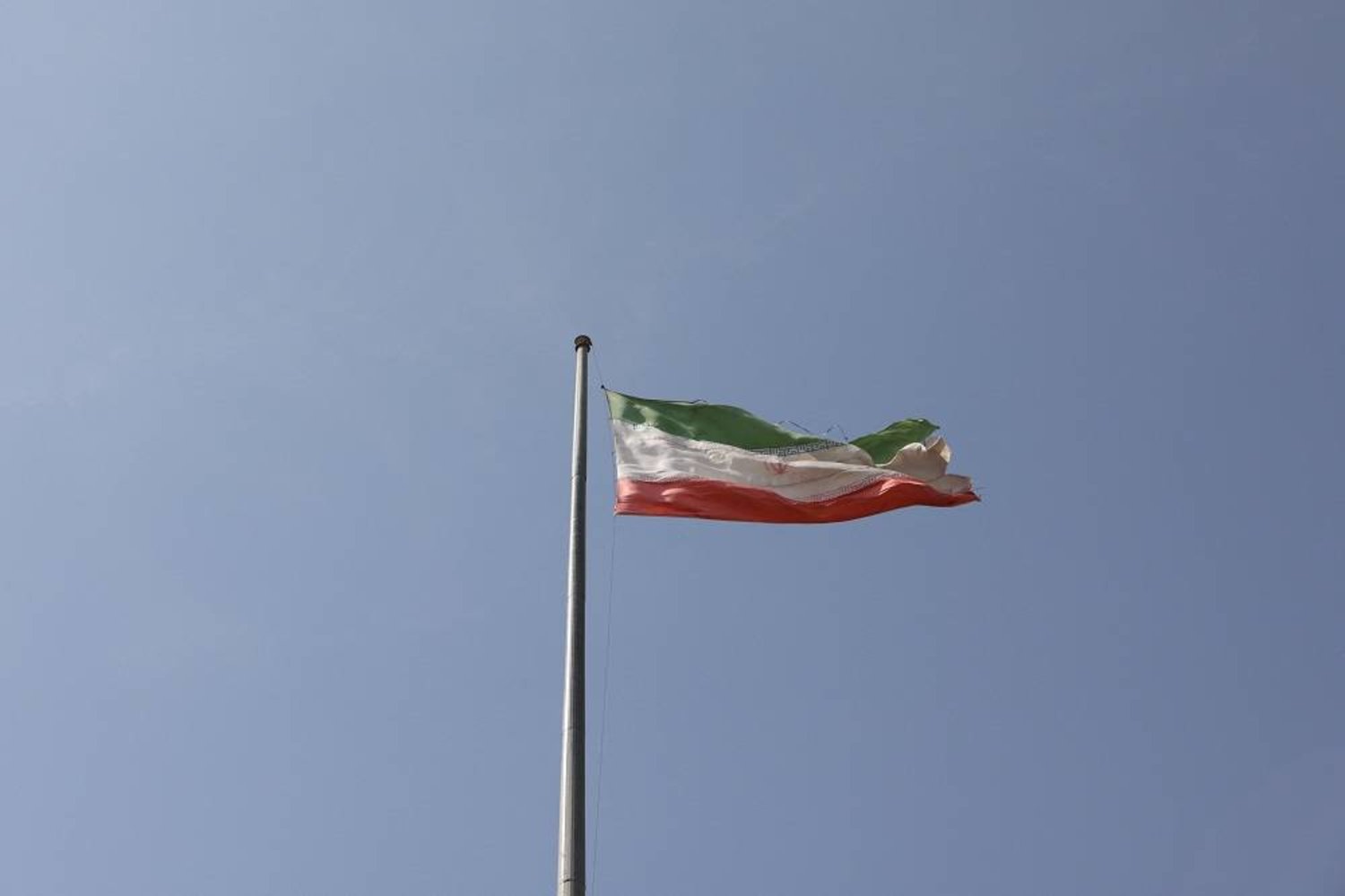 The Iranian flag is seen flying over Evin prison in Tehran, Iran October 17, 2022. Majid Asgaripour/WANA (West Asia News Agency) via Reuters 