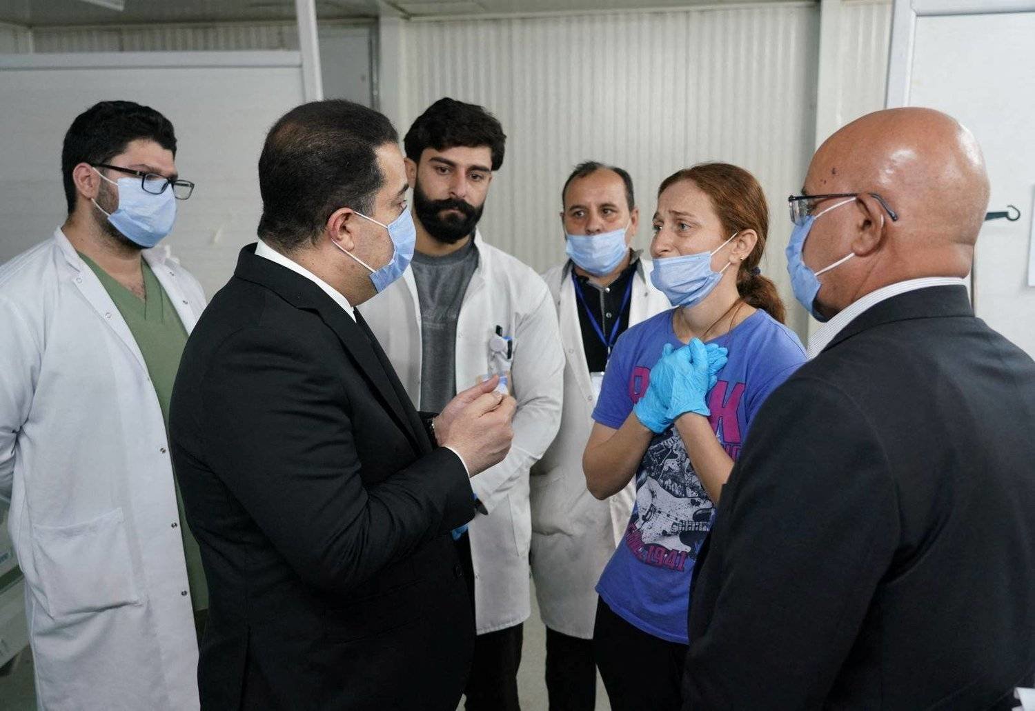 Sudani speaks to medical staff at Al-Hamdaniya Hospital in northern Iraq (Reuters)
