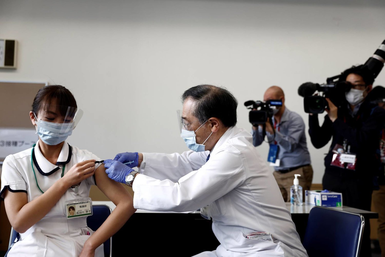 A medical worker receives a dose of the COVID-19 vaccine at Tokyo Medical Center. Reuters