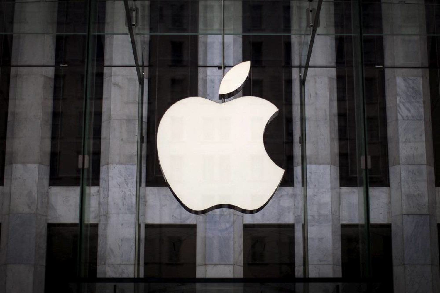 An Apple logo hangs above the entrance to the Apple store on 5th Avenue in the Manhattan borough of New York City, July 21, 2015. (Reuters)