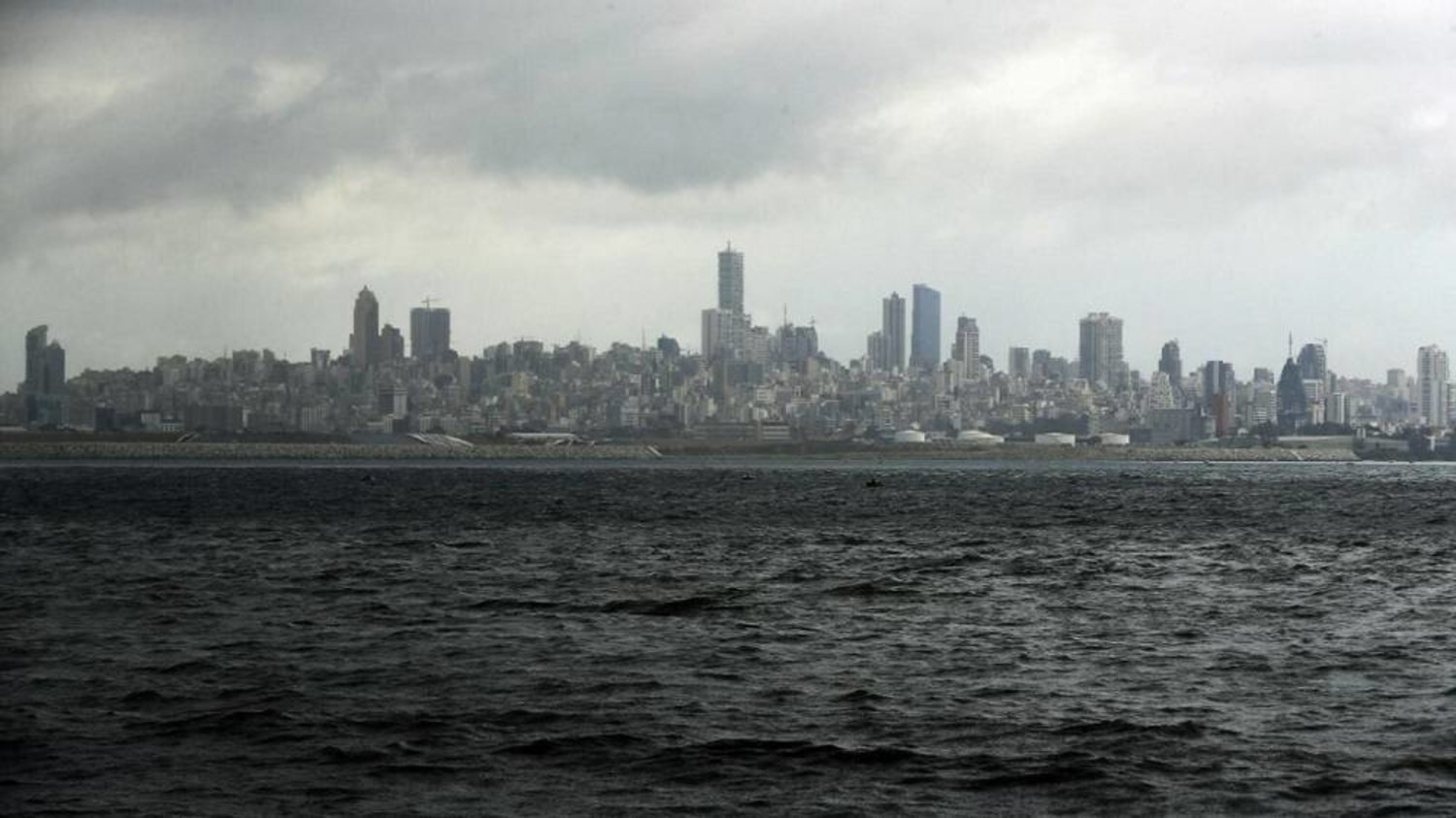 A picture taken from the seaside promenade of the northern Lebanese coastal town of Dbayeh shows the skyline of the Lebanese capital Beirut on March 17, 2020. (AFP)