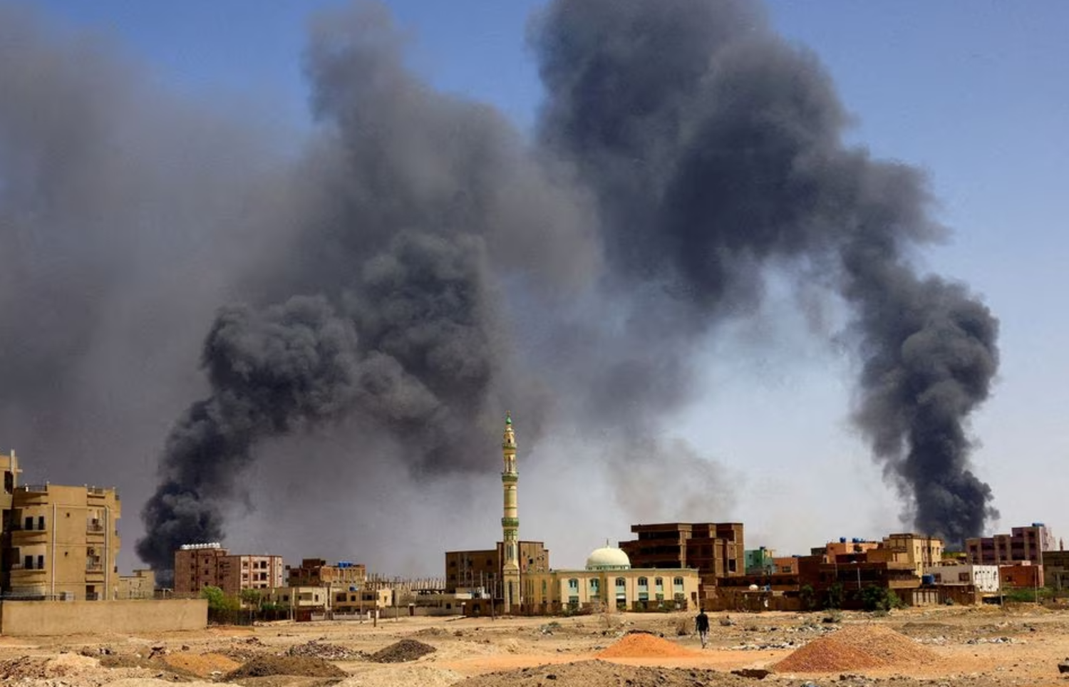 Smoke rises above buildings during clashes between the paramilitary Rapid Support Forces and the army in Khartoum (Reuters)