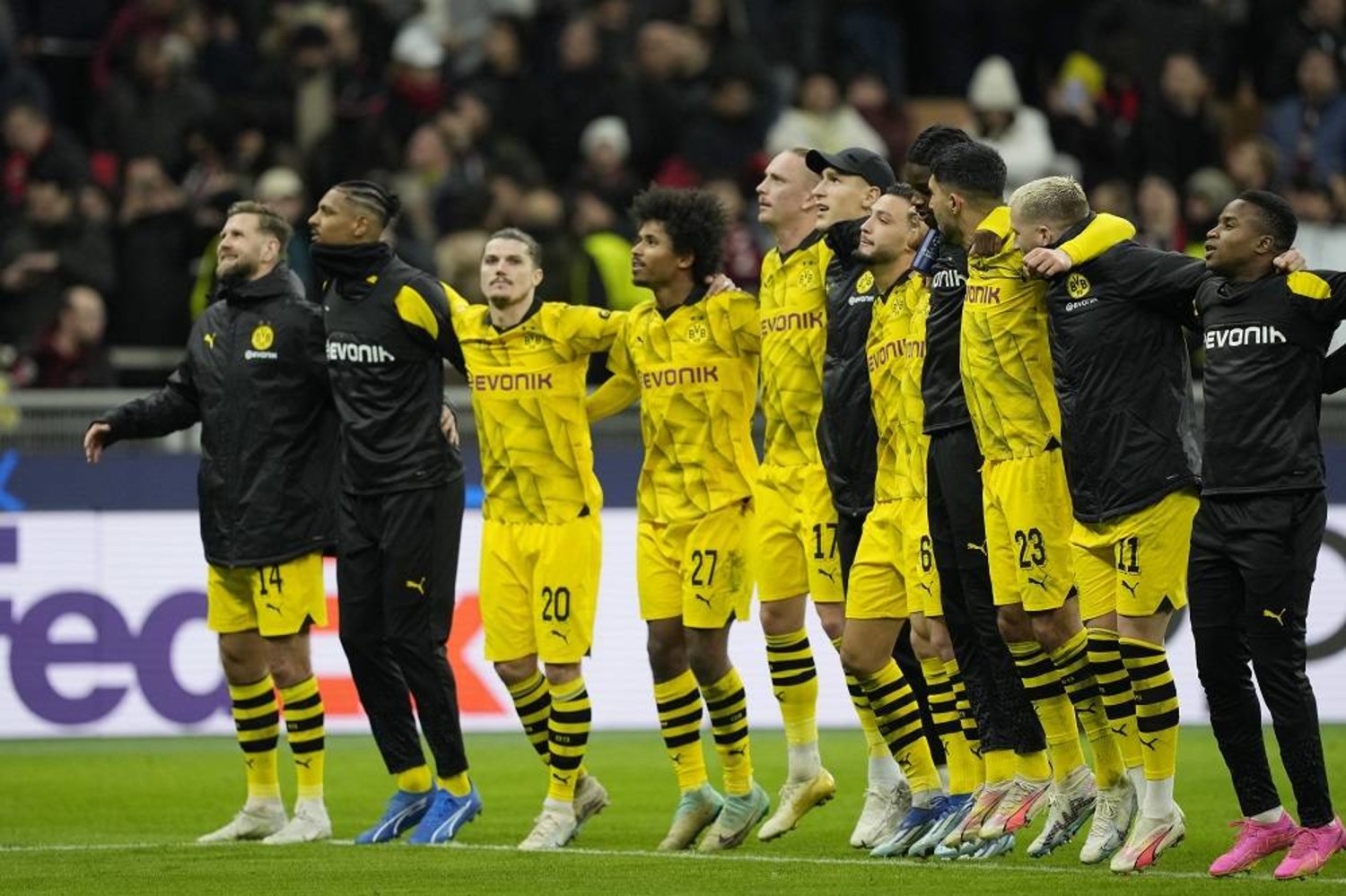 Dortmund's players celebrate after winning the Champions League group F soccer match between AC Milan and Borussia Dortmund at the San Siro stadium in Milan, Italy, Tuesday, Nov. 28, 2023. (AP)
