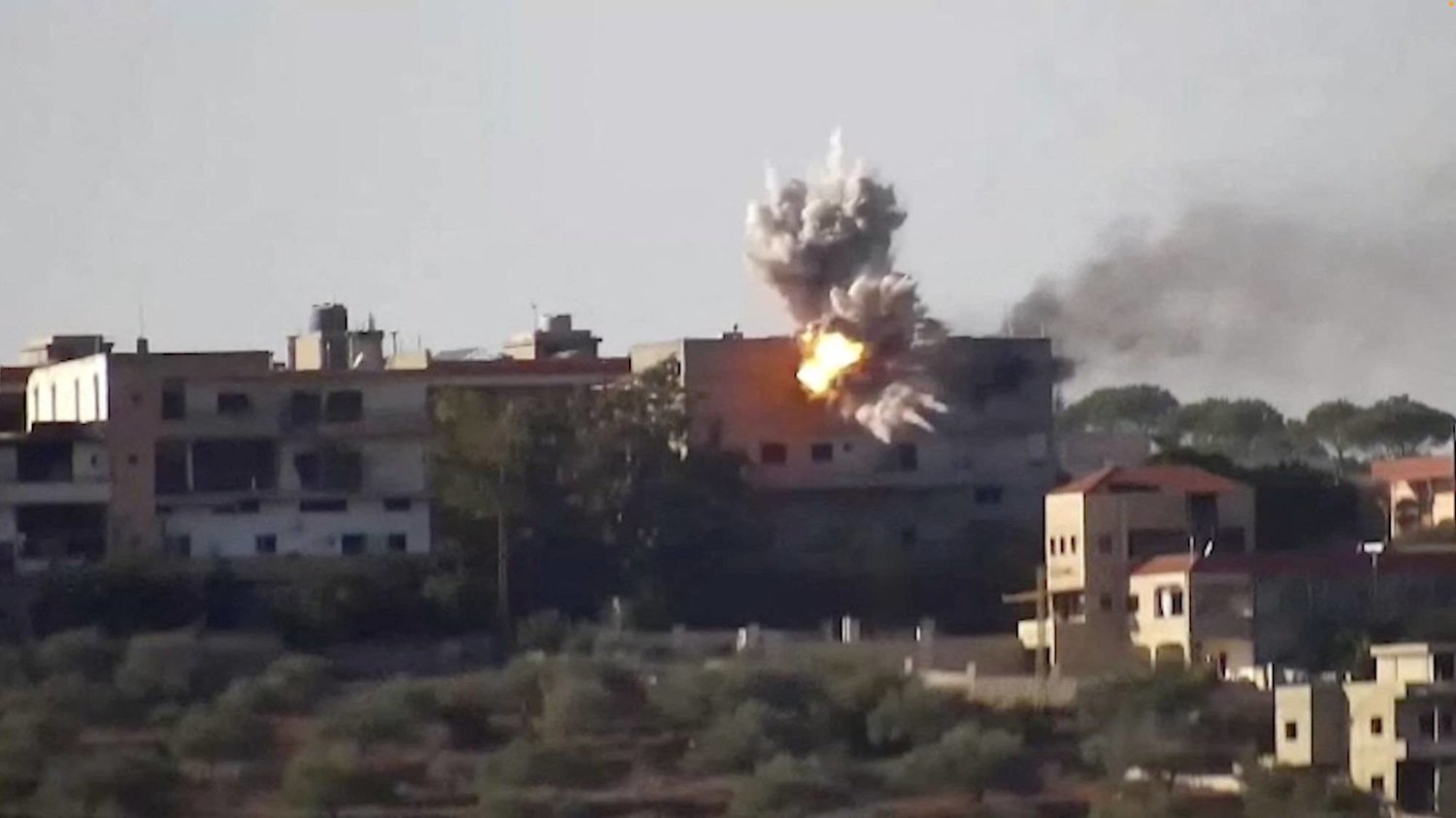 Smoke and fire rise from a building following an Israeli strike on what the Israeli military says are Hezbollah targets in a location given as Lebanon, amid the ongoing cross-border hostilities between Hezbollah and Israeli forces, in this screengrab taken from an undated handout video released on November 24, 2023.  Israeli army/Handout via REUTERS  
