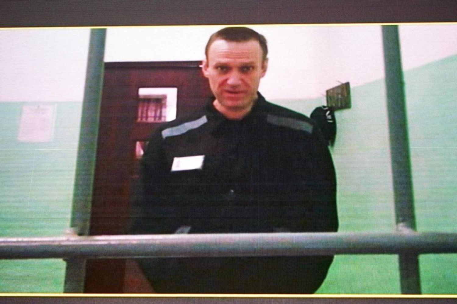 Jailed Russian opposition figure Alexei Navalny is seen on a screen via a video link from his penal colony during court hearings over the extremism criminal case against him at the Russia's Supreme Court in Moscow on June 22, 2023. (AFP)